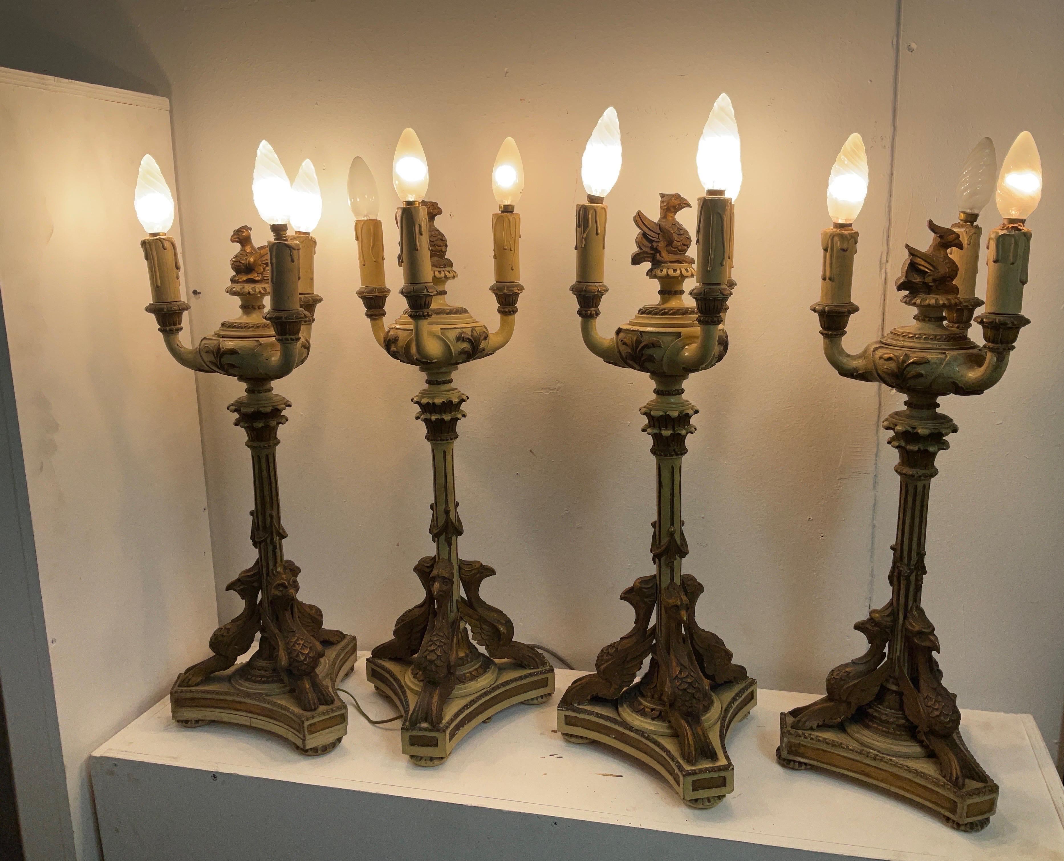 Lacquered and gilded wood candlesticks in empire style from the late 1800s in good condition with small wear and tear caused by years and use. Please review the attached images carefully. The empire style is one of the most appreciated to this day