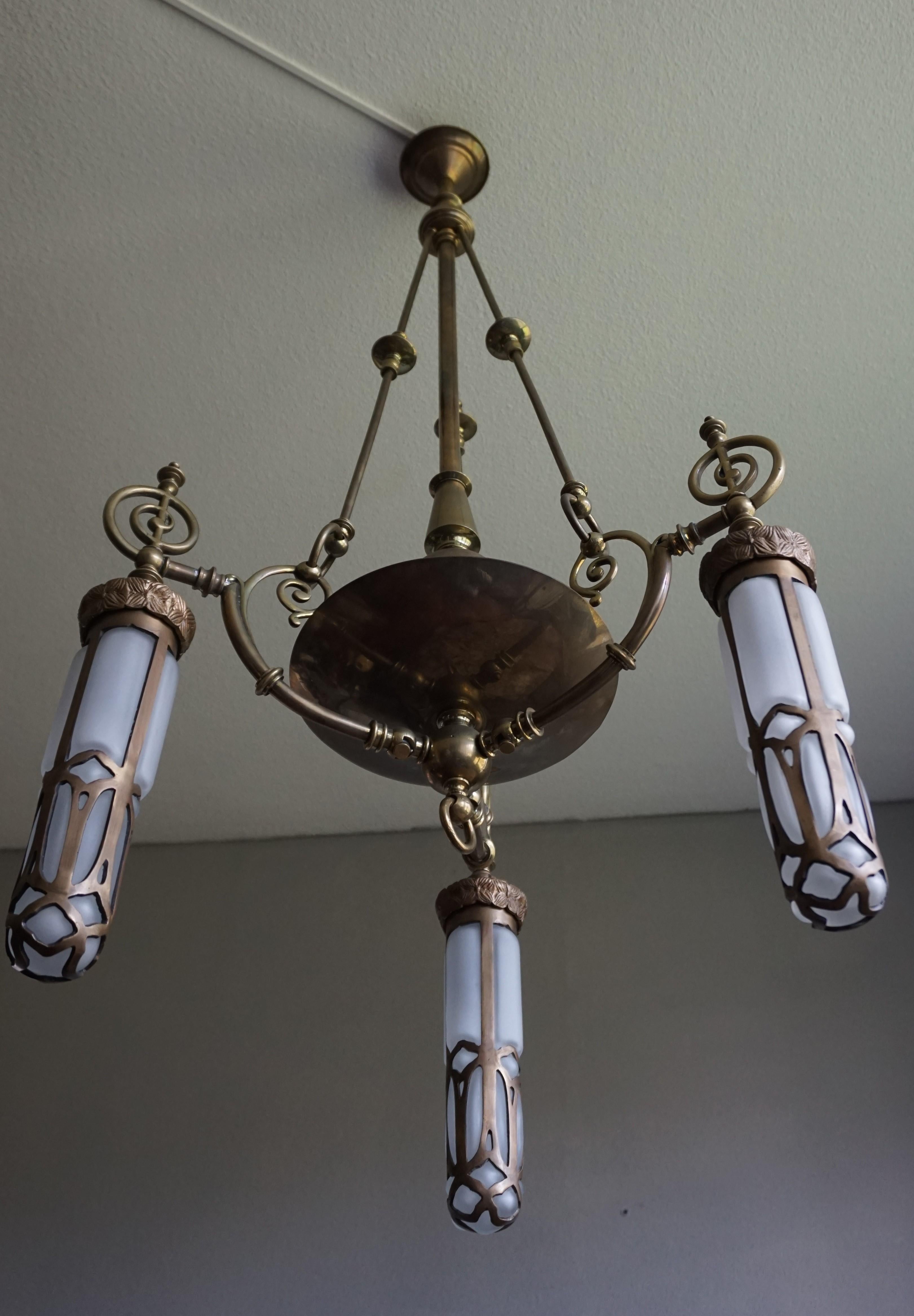 All hand-crafted and very stylish, former gas-light fixture.

If you are looking for a unique light fixture to grace your living space then this pendant could be the one. This handsome work of lighting art from the 1890s was originally made as a