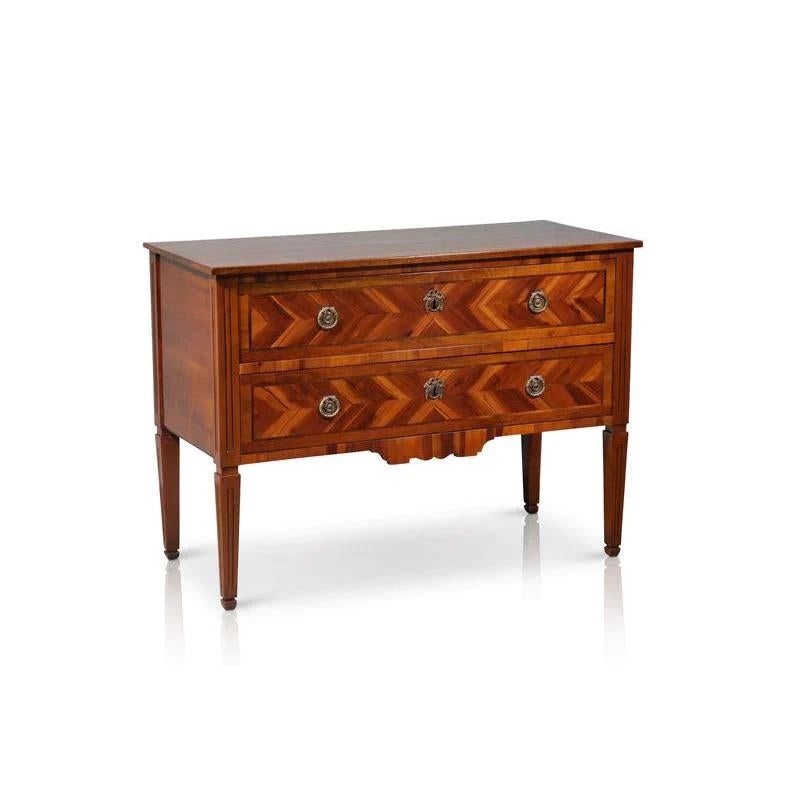 This late 1800’s English Walnut Parquetry Commode comes with its Original Key and was purchased by us in Italy. It has a stunning almost herringbone type of marquetry on the front patina and is in impeccable restored condition. Pieces of this nature