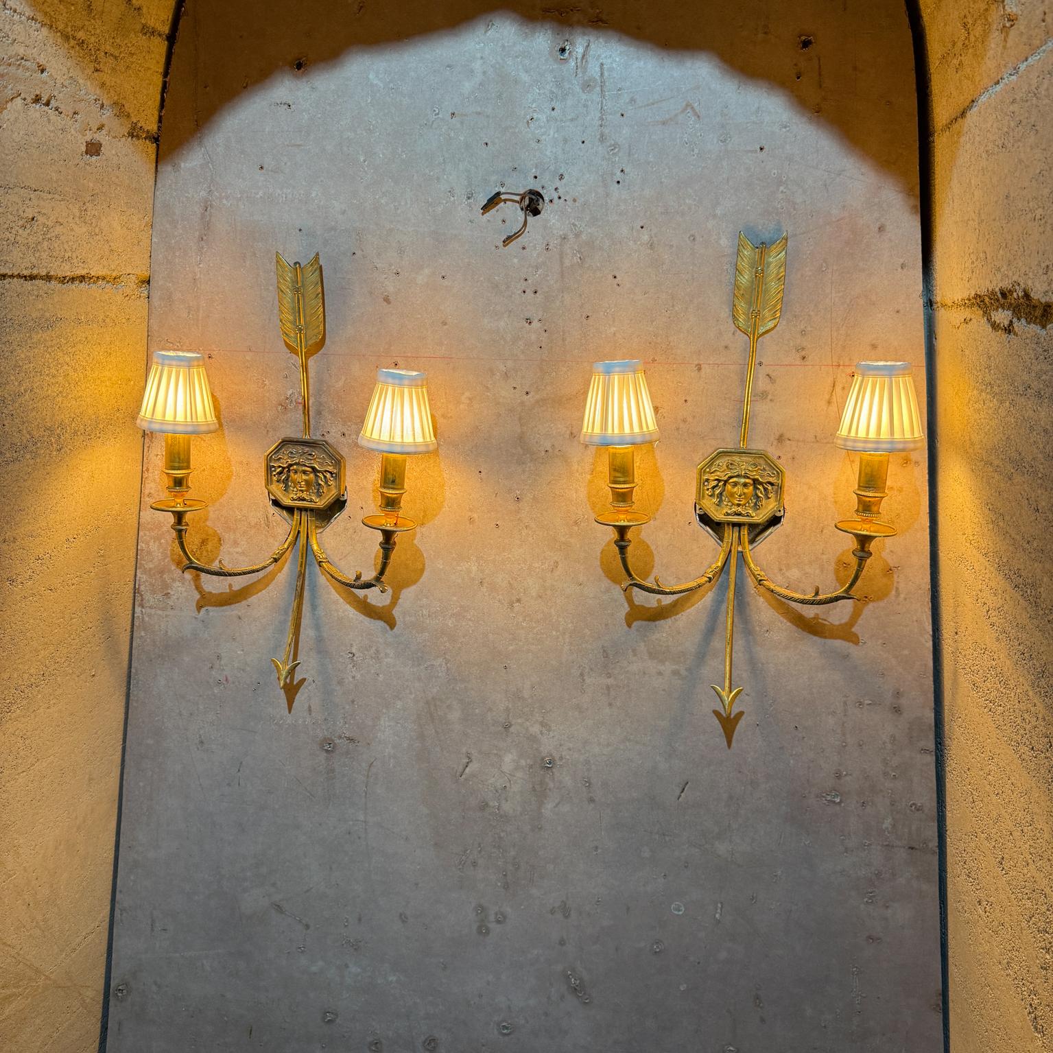 French Empire Wall Sconces Bronze Arrow Medusa late 1800s.
2 arms per each sconce
unmarked
21 h x 12.5 w 4.5 d inches
Retrofitted in France from candle to electric wall sconce.
Small bayonet bulb required; not included.
Preowned vintage