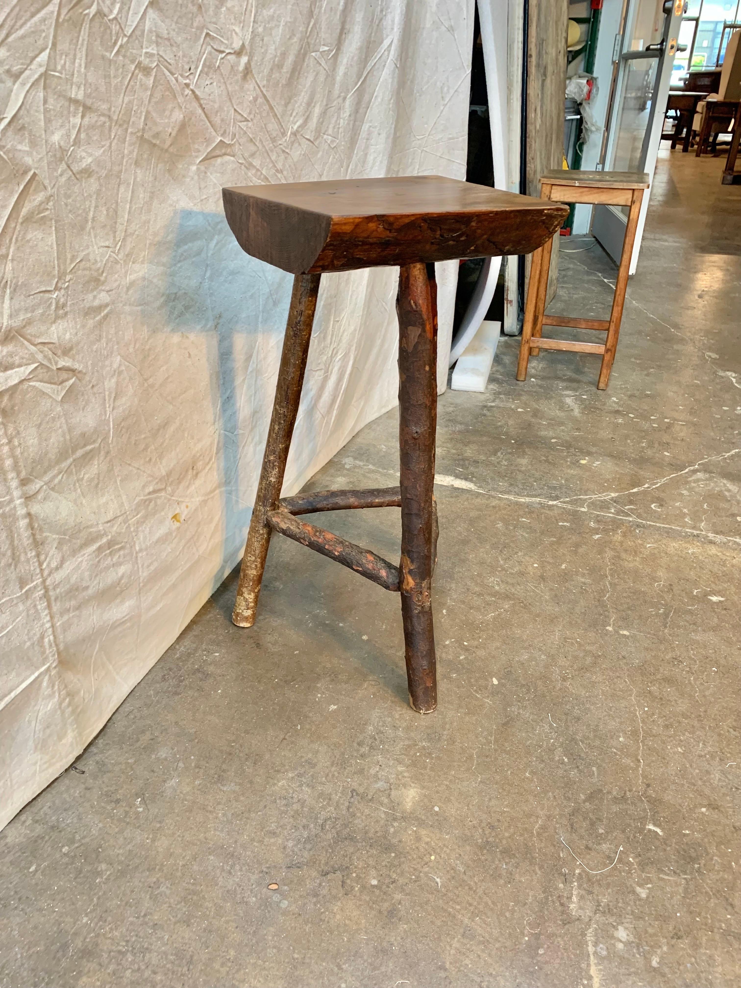 Found in the South of France, this rustic stool or side table was hand crafted using a natural pine tree trunk and branches and dates to the late 1800's. Whether you are decorating a midcentury home, a mountain cabin or a more traditional interior,