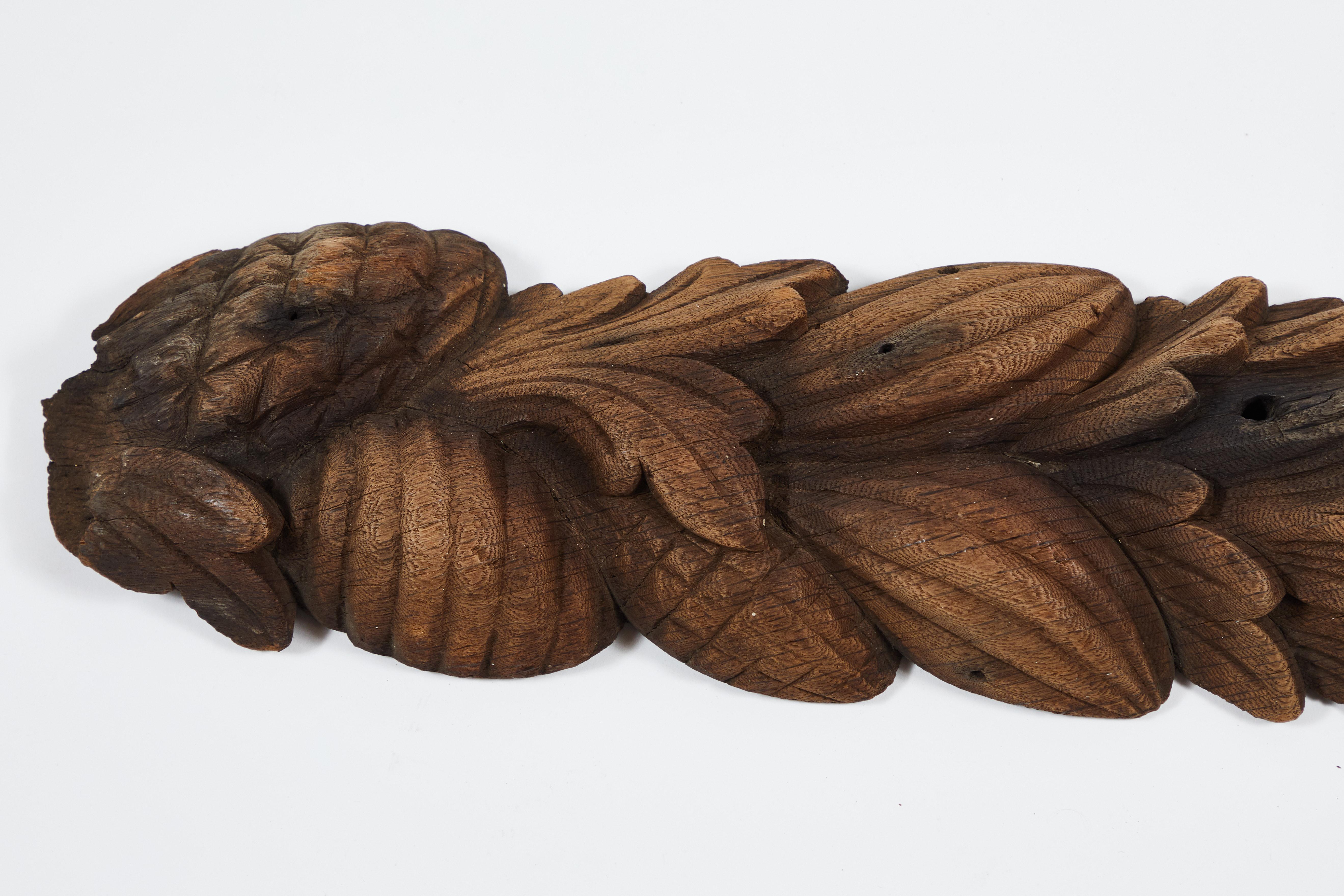 This found sculptural element was probably part of a large piece of furniture or an interior or exterior architectural decoration. With weathering to its hand carved fruits, vegetables, and leaves, It does show evidence of its time in use outdoors.