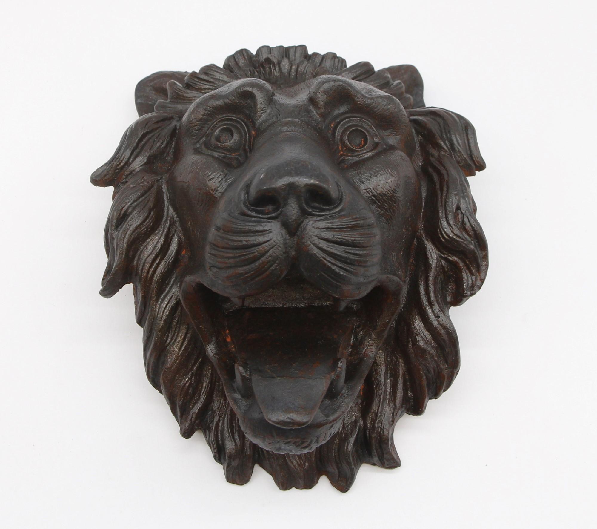 Late 1800s heavy solid cast iron lion head with ornate detail. Slightly concave side profile. Please note, this item is located in one of our NYC locations.