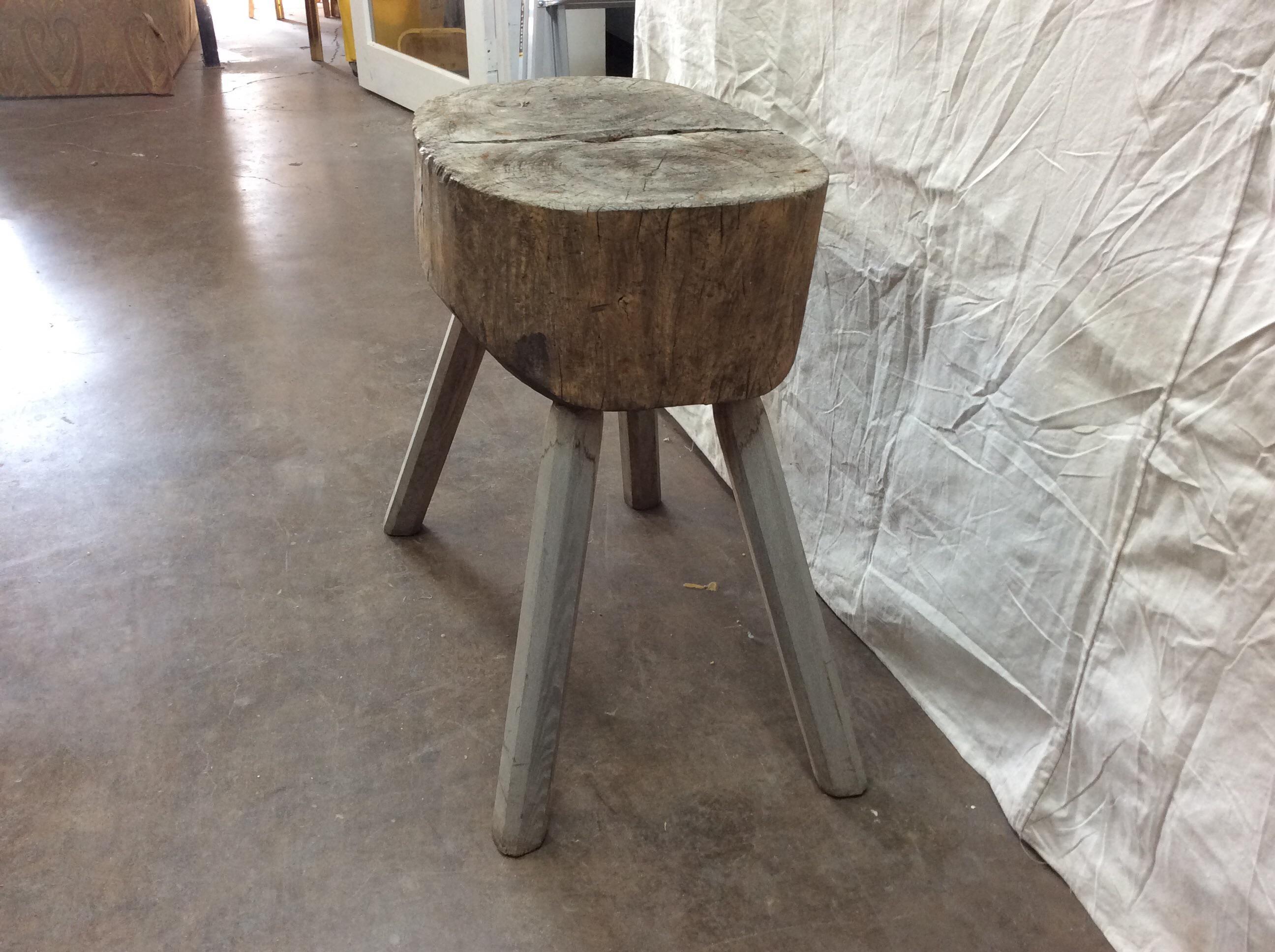 Found in Provence, this rustic French Butcher Table was probably used in an outdoor market or on a farm. Handmade from a single tree trunk the butcher block stands on four legs. A unique accent table, this will surely be a conversation