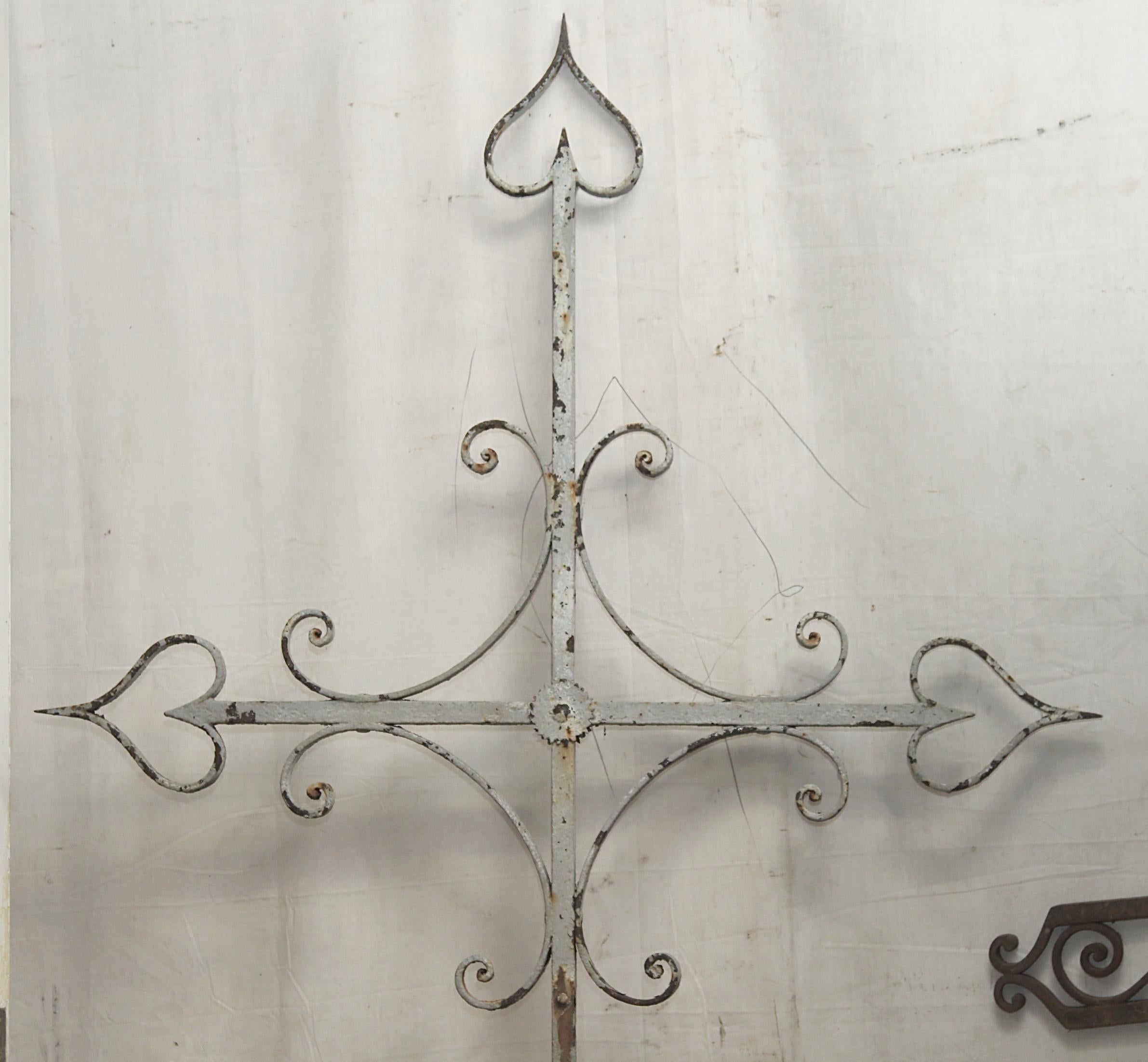 Late 1800s French hand wrought iron cross, This cross still features the original silver paint and patina. This can be seen at our 302 Bowery location in NoHo in Manhattan.