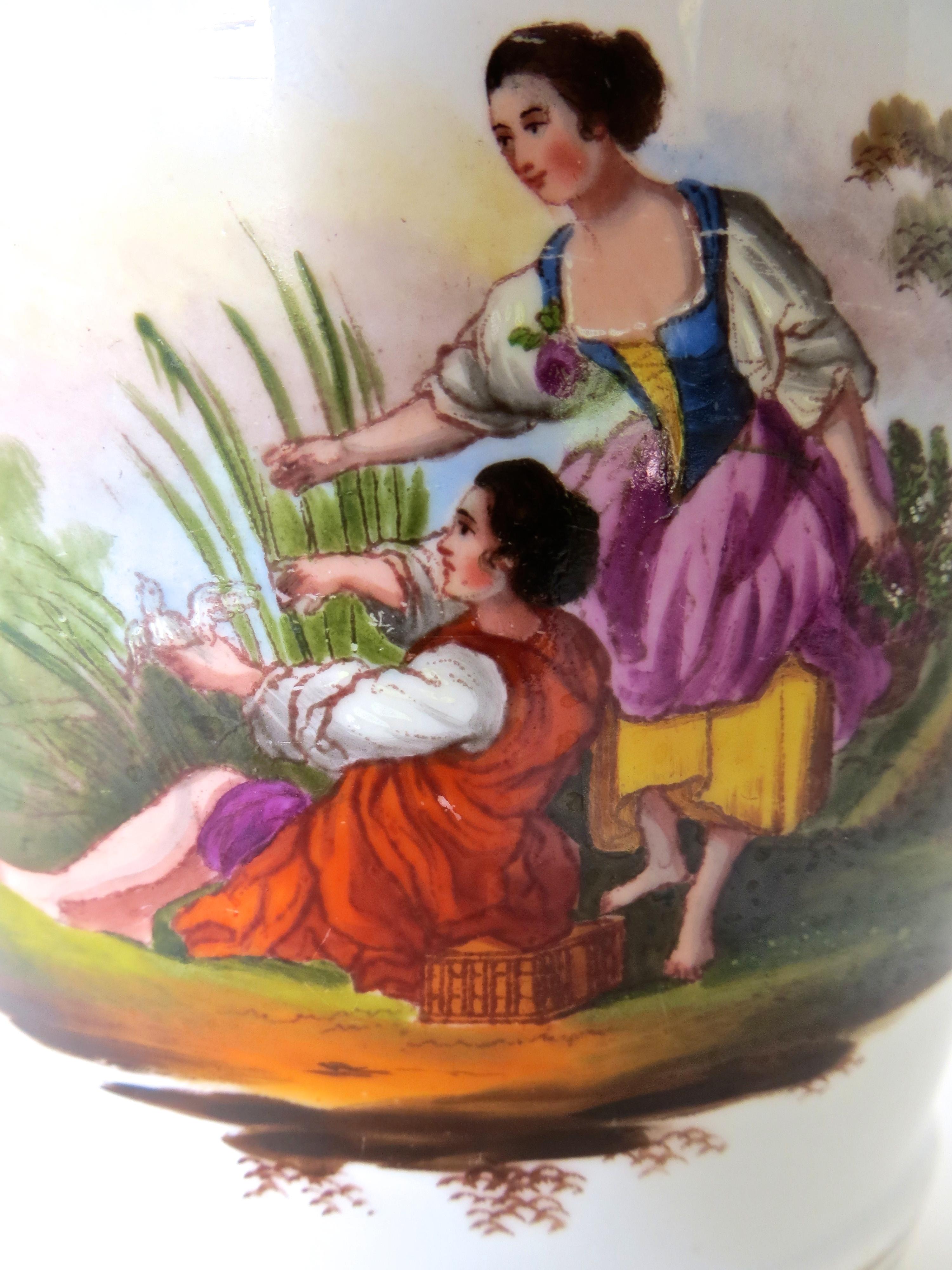 Fine quality English late 18th century faience planter or pot, with accompanying small porcelain stand. The hand painted image depicts a young couple handsomely dressed in bright colors, seated beneath a tree in a country setting (see image). A four