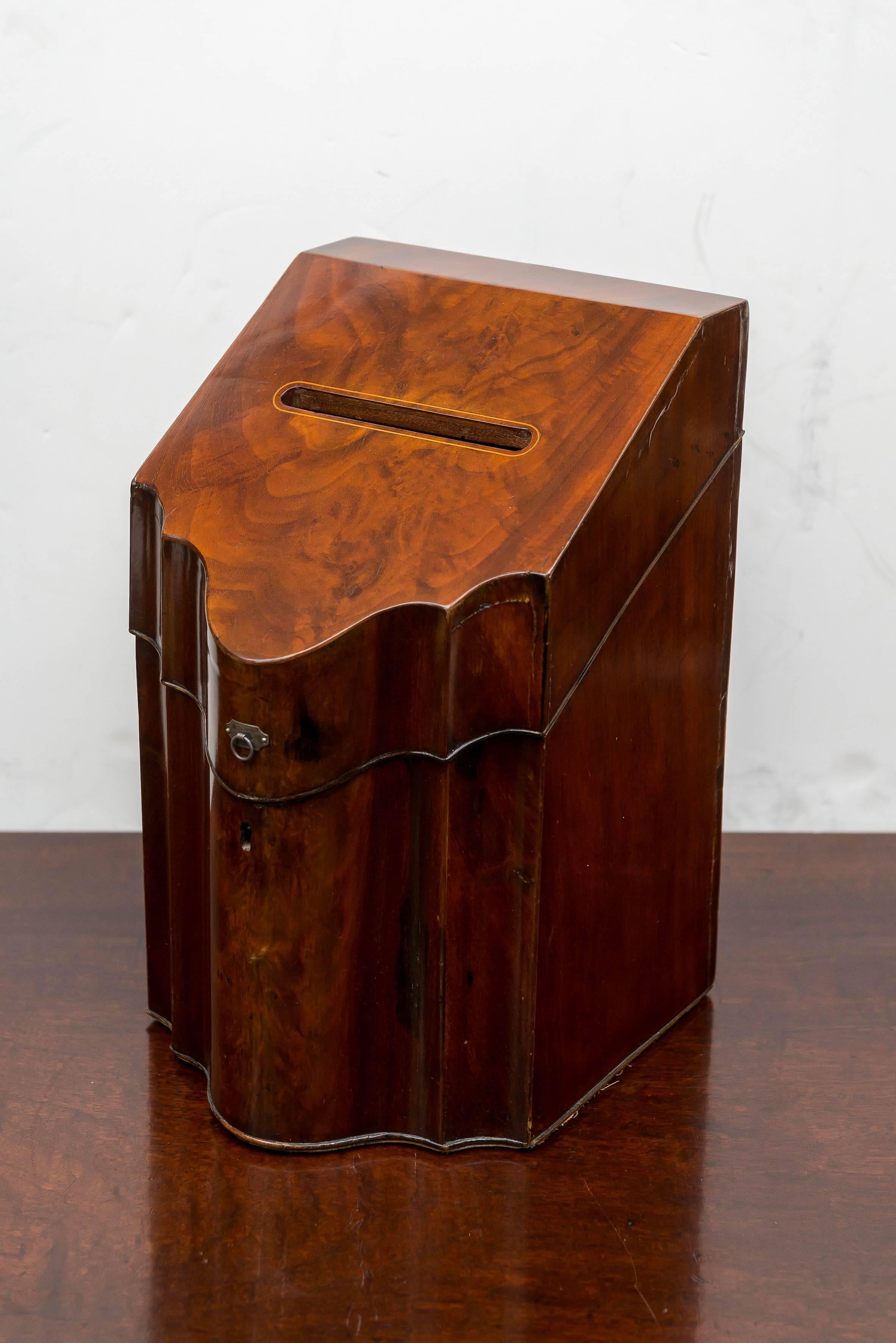 Late 18th century, English George III mahogany knife box fitted out for letters / ballots. The interior voided of the old knife compartments. One small removable interior leather insert fitted in the front portion. This was probably for a ceremonial
