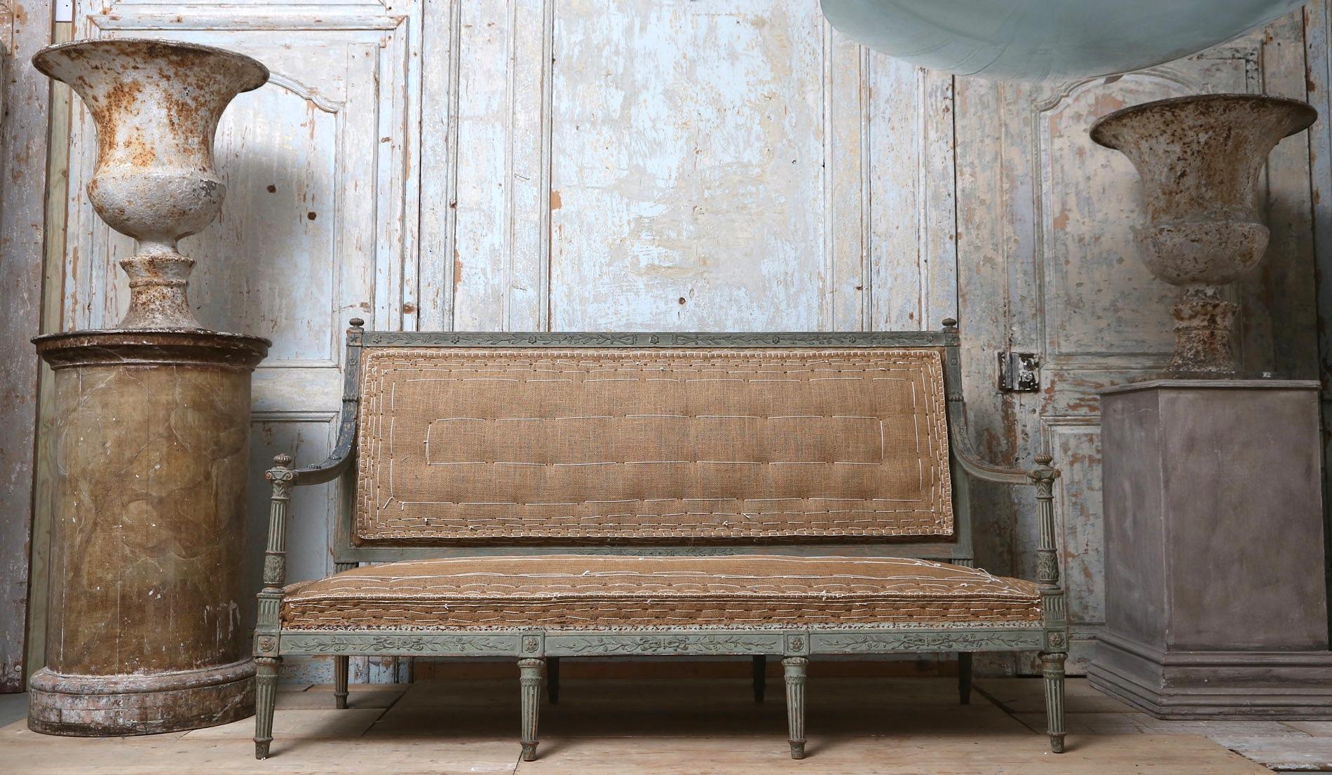 A wonderful example of a late 18th century French Directoire sofa / canapé with detailed carving and original paintwork
It has been upholstered using traditional French period upholstery technique methods finished in jute.