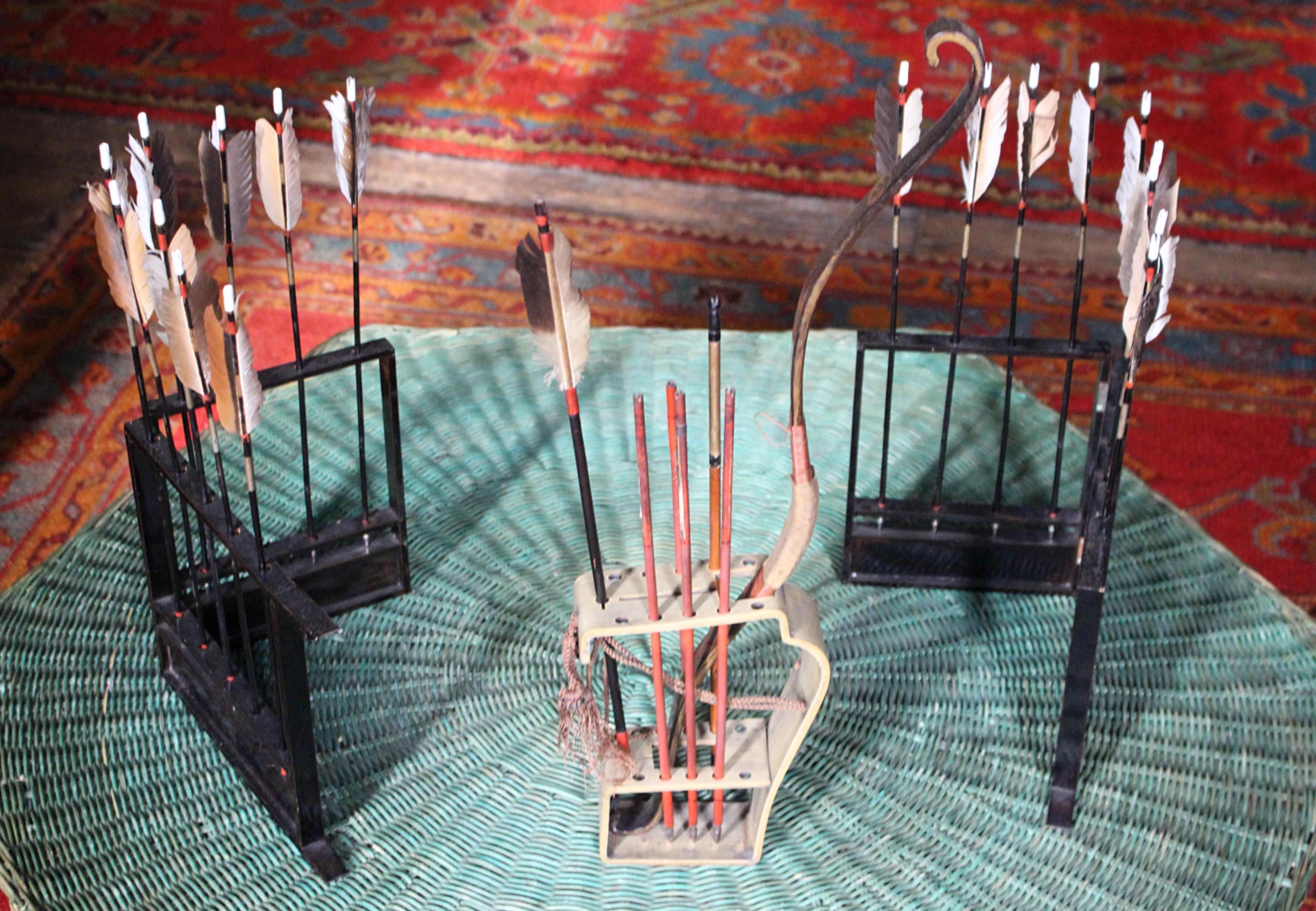 A Japanese Edo Period Palanquin Bow (Rimankyuu) with two racks of arrows. 

The bow with reflexed design made of whalebone, the back and belly painted with golden mon and the grip (nigiri) covered in deer hide with rattan bindings, the nocks curved
