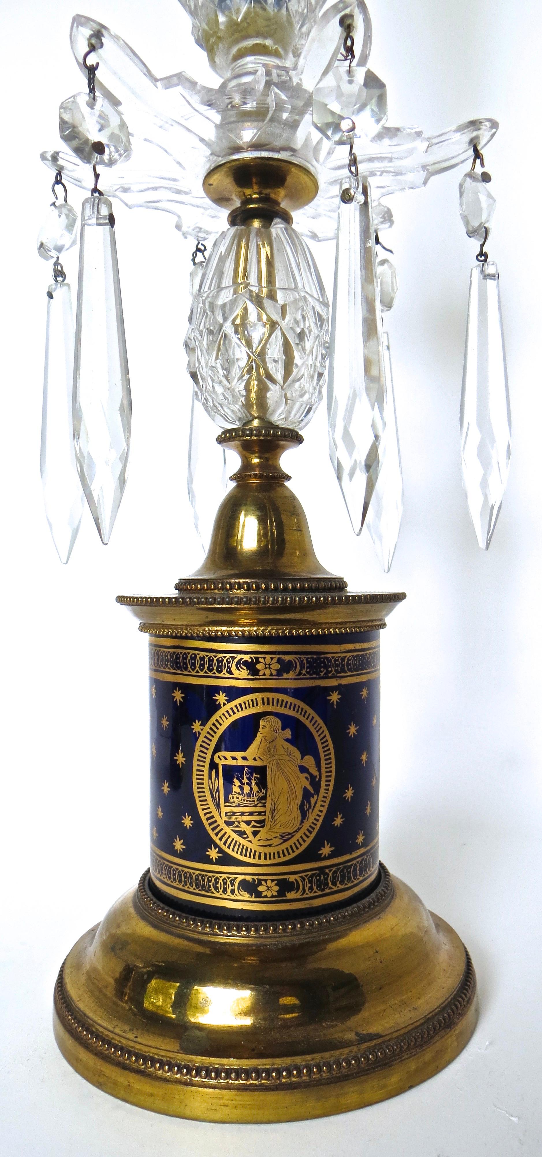 Rare pair of blue glass and ormolu lustre George III candlesticks in their original and untouched condition. The circular blue glass cylinders are mounted on an ormolu base with beaded decoration cast into the circumference (top and bottom). The