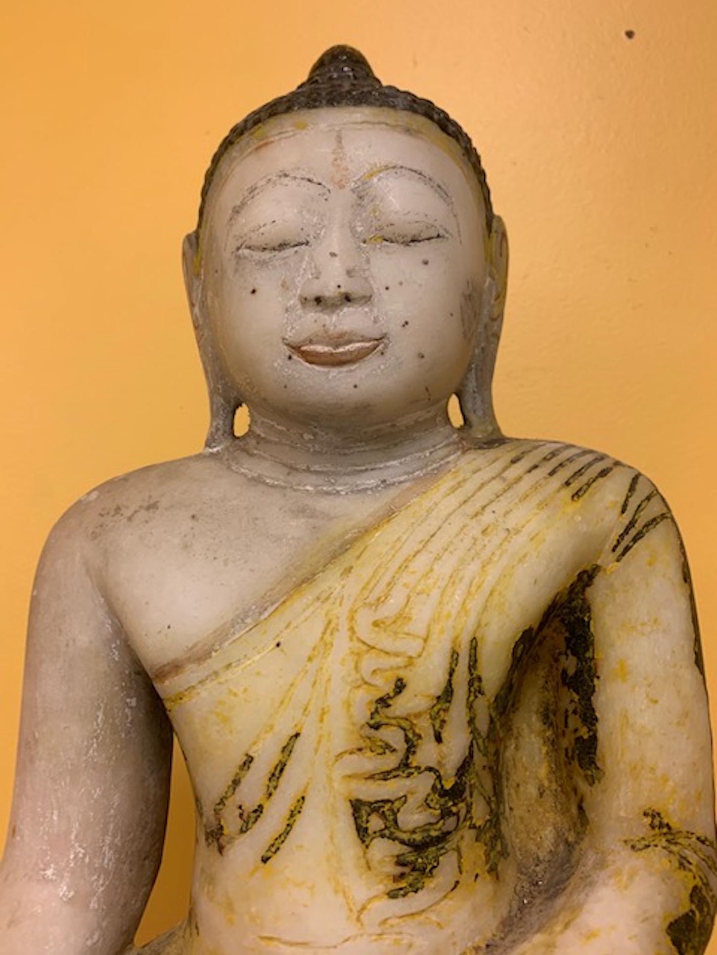 Late 18th century Stone Shan State, Burmese, (Myanmar) Buddha collected eighteen years ago in the Shan State while collecting for an Asian Art museum. Absolute stunning presence with pigments left over from the many Buddhist cleansing ceremonies it