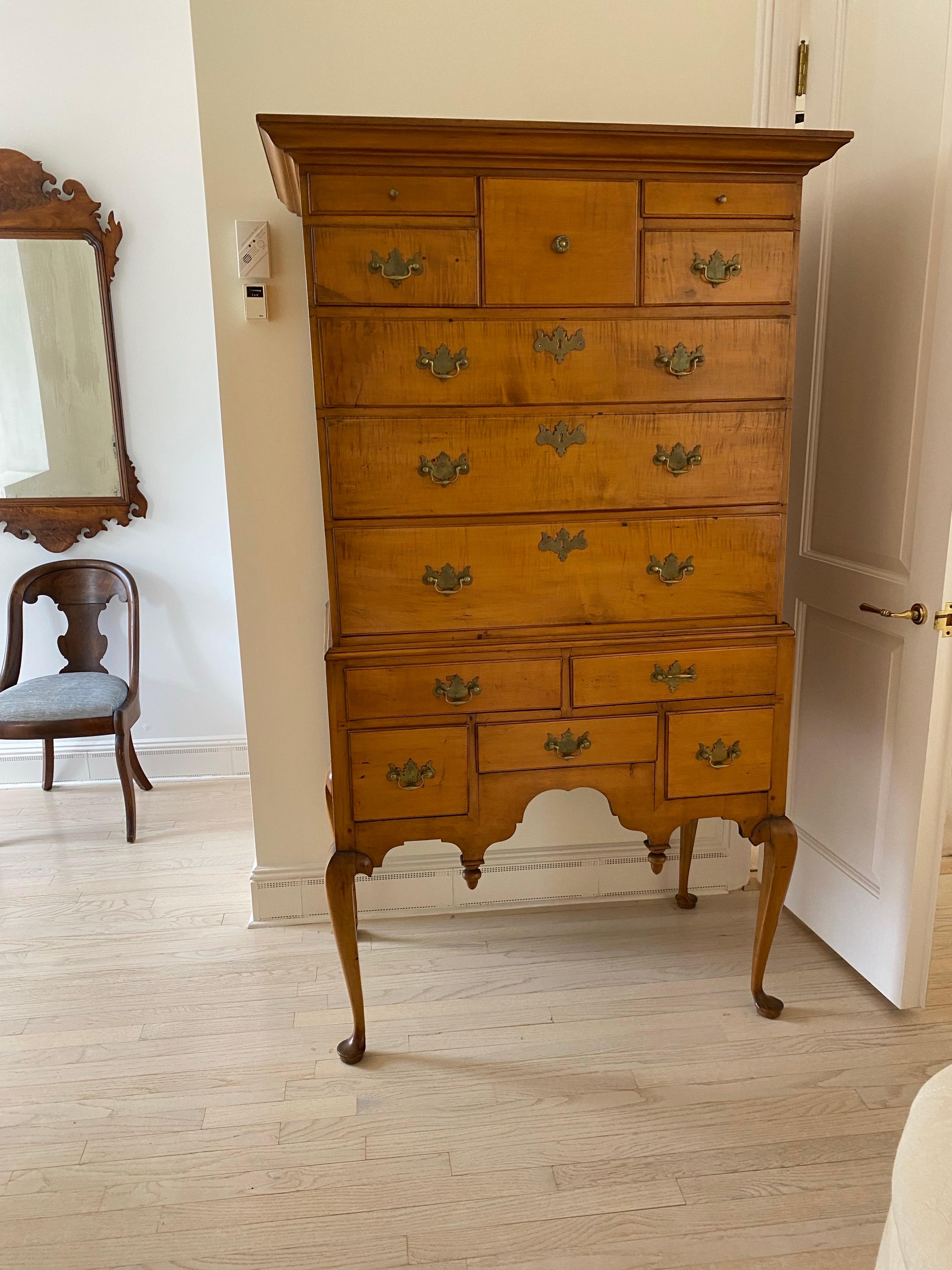 Late 18th Century American Queen Anne Flat Top Maple Highboy Double, 
Four short drawers with central cellarette over three graduated long drawers, over a base fitted with five short drawers. Scalloped apron with 2 downturned finials on cabriole