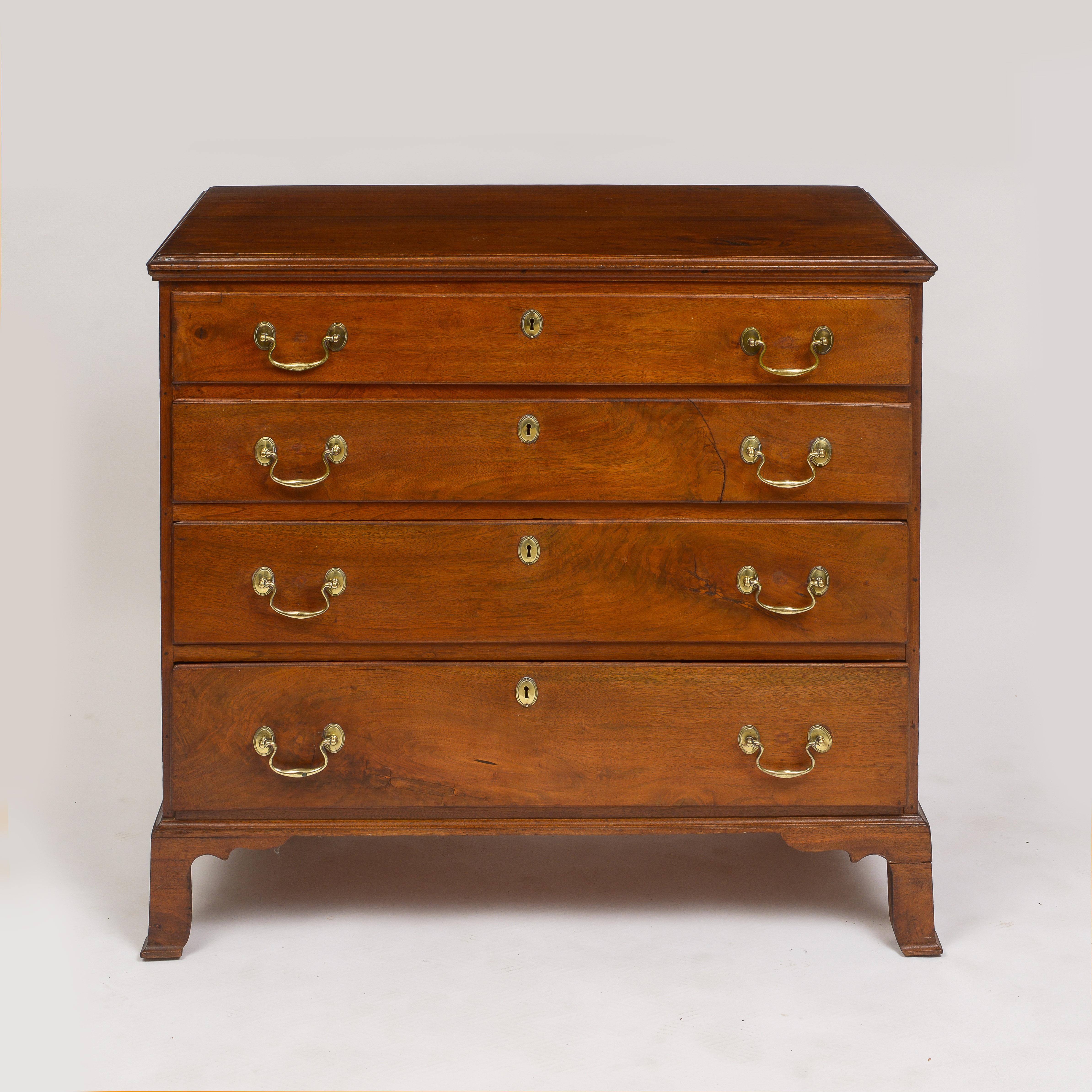 Well figured American walnut
Four drawer chest
Supported by high bracket feet
Early open bale brass hardware