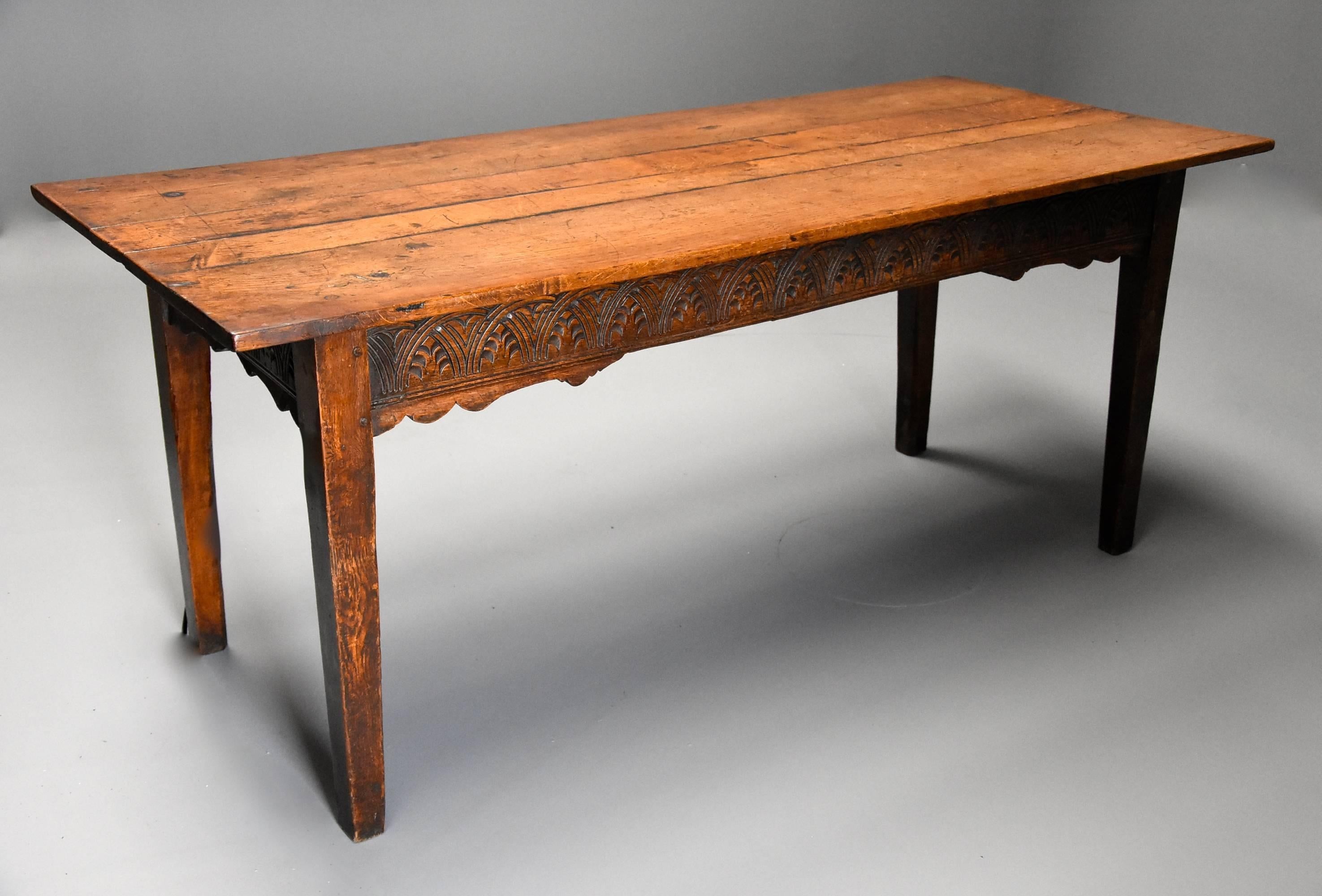 A late 18th century (circa 1790) and earlier oak farmhouse table of superb patina (color).

This table consists of a solid oak plank top of superb patina leading down to reclaimed mid-17th century (circa 1650) rails, three of the rails to the