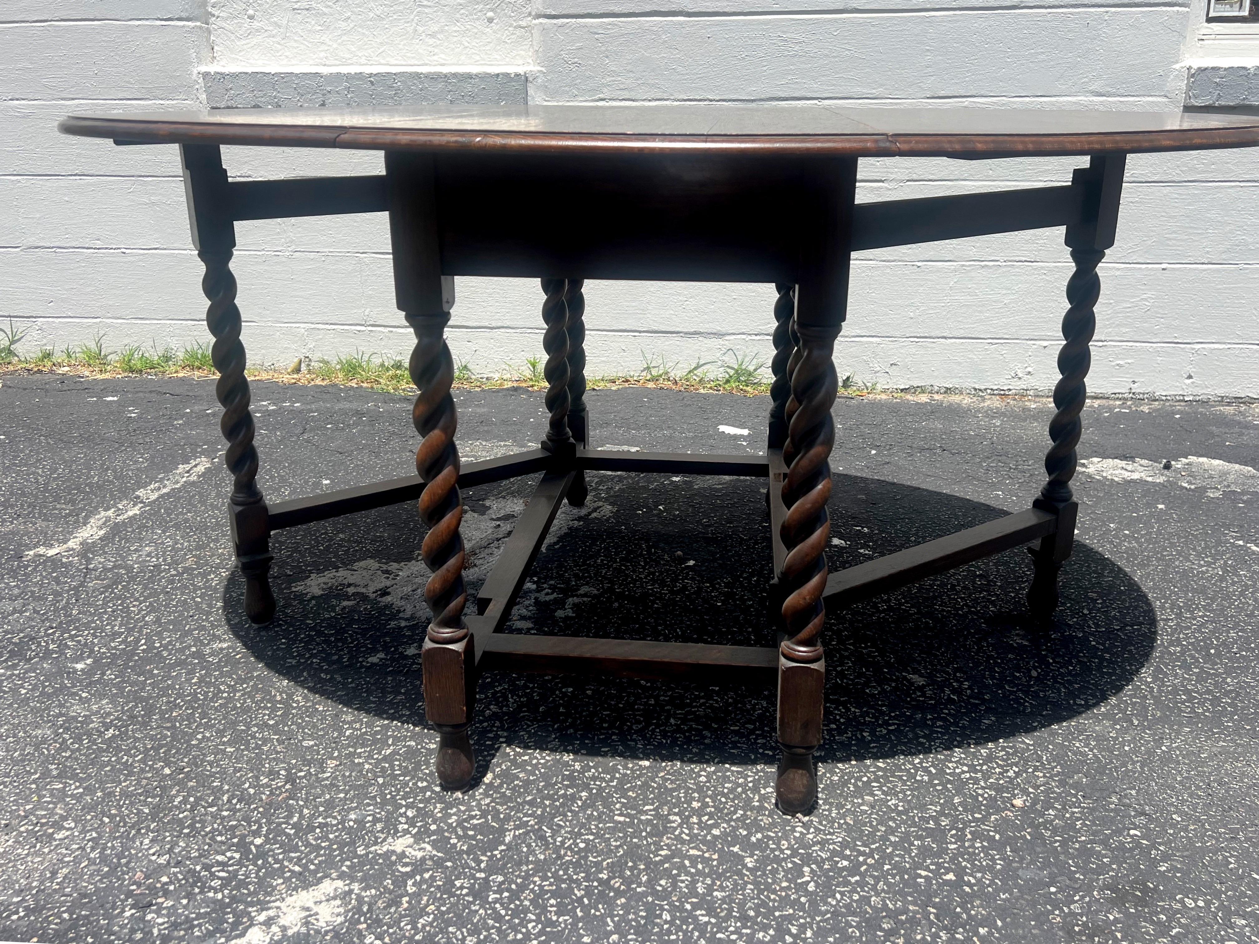 A fantastic and versatile stunning English barley twist gate leg table. From an entryway, to behind a sofa, to the dining room. This classic table is absolutely gorgeous and works in almost any home. 
19” closed
Leaf measures 20.25”.