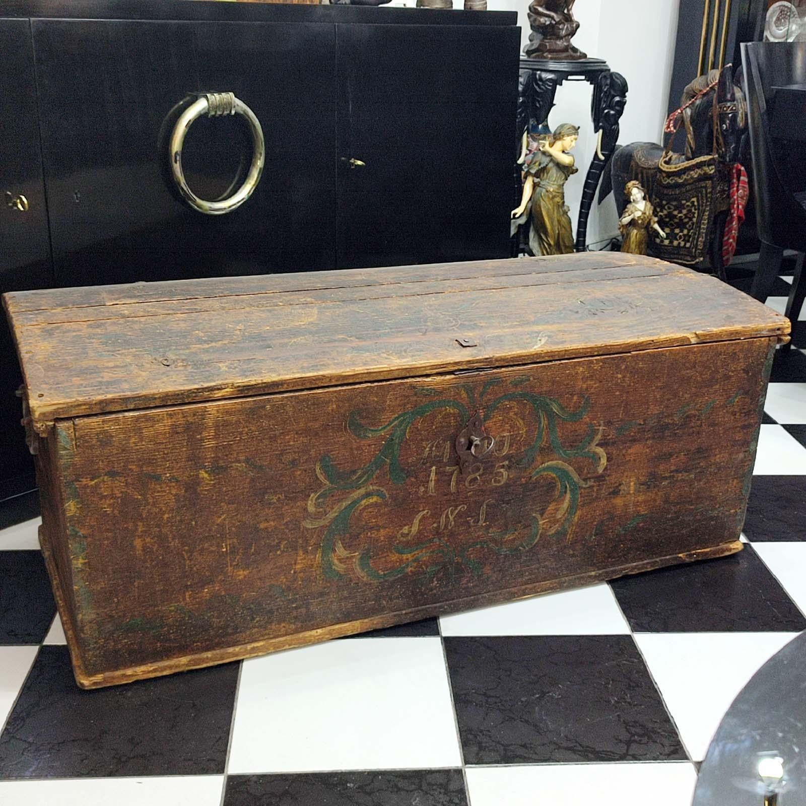 An original condition 18th century domed-top dowry chest, painted with floral motif and dated 