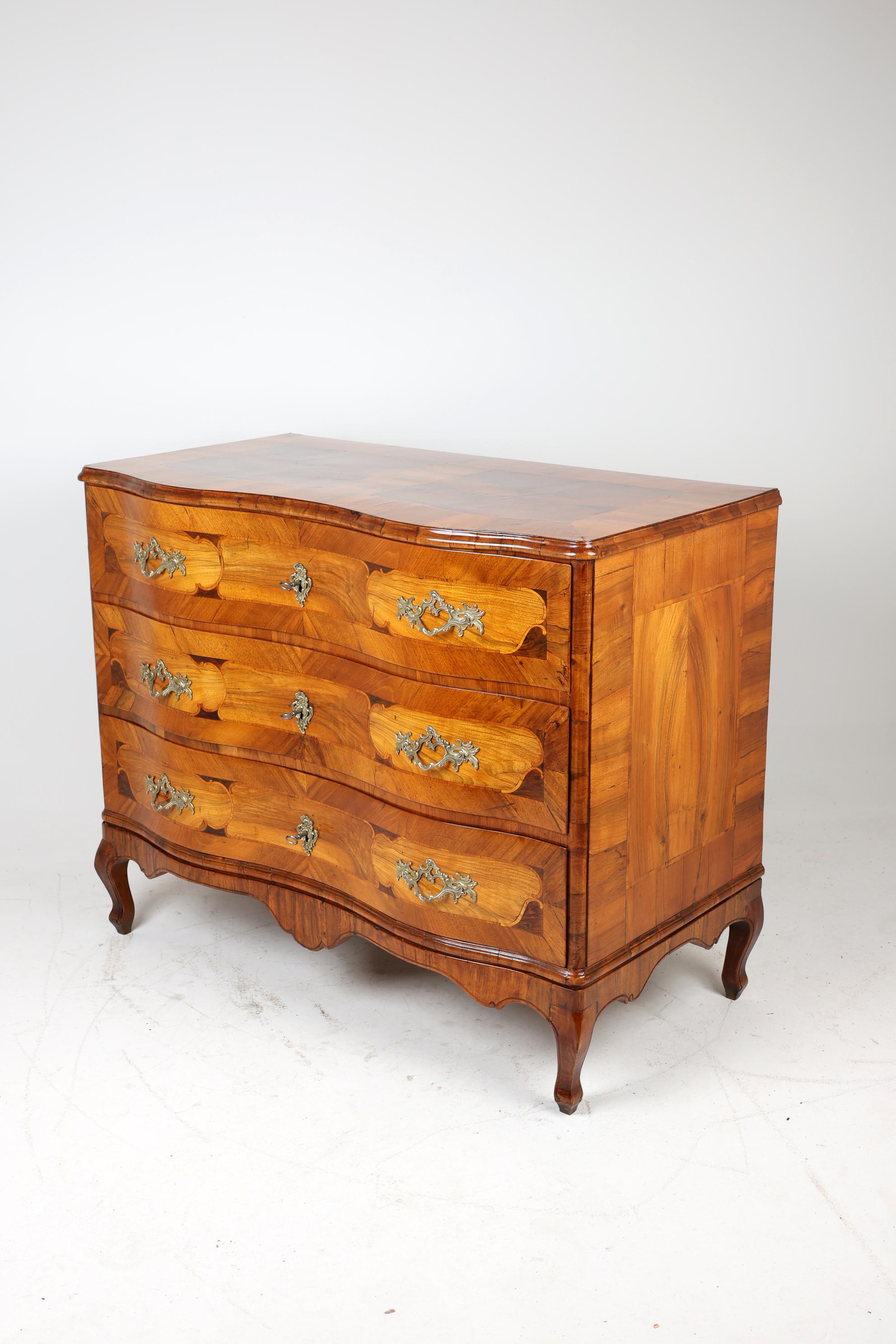 Late 18th Century Baroque Commode,
1780-1790, Germany
Walnut

Beautiful baroque walnut chest of drawers with three drawers, made in Franconia at the end of the 18th century. The chest of drawers impresses with its authentic antique look and elegant