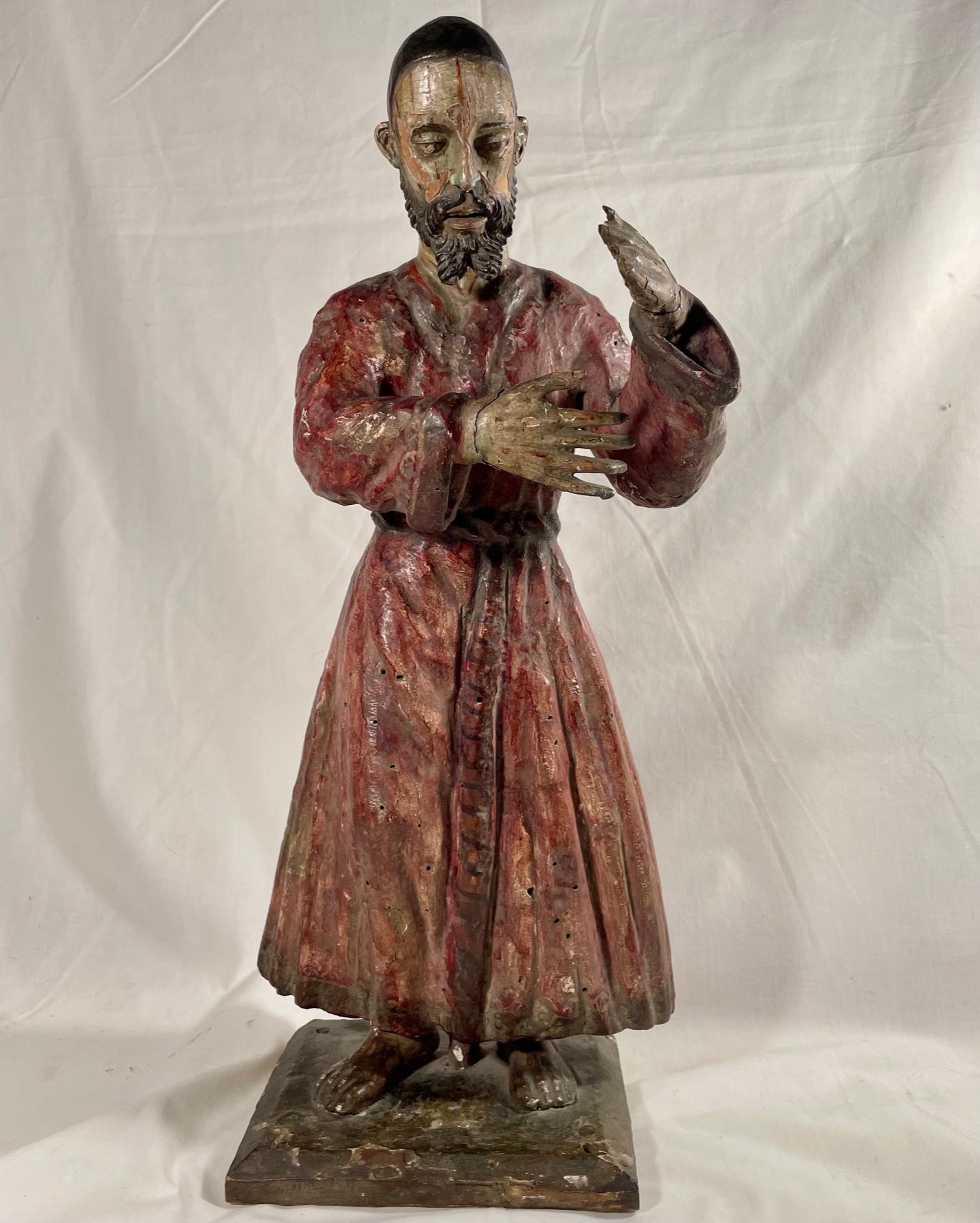 Late 18th century carved and polychrome Italian Santo statue

Antique Italian religious hand carved wood Santos of Saint John. This exceptional Baroque style figure of the late 18th century is beautifully decorated with polychrome paint. Minor