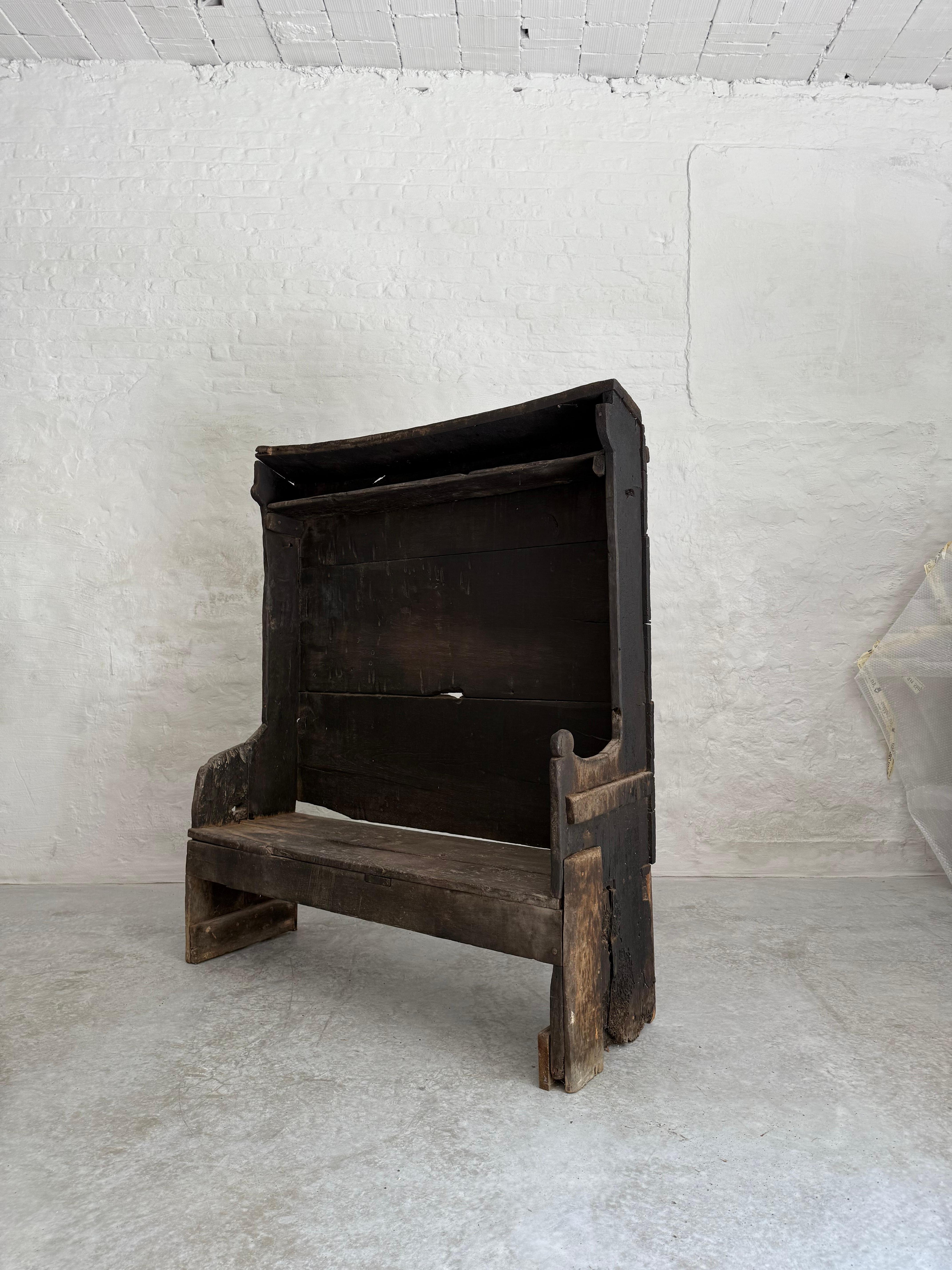 A large late 18th C. Catalan bench from the Pyrenees.
Beautiful old dark patina and texture from years of use. 
Solid construction made out of large planks. 

