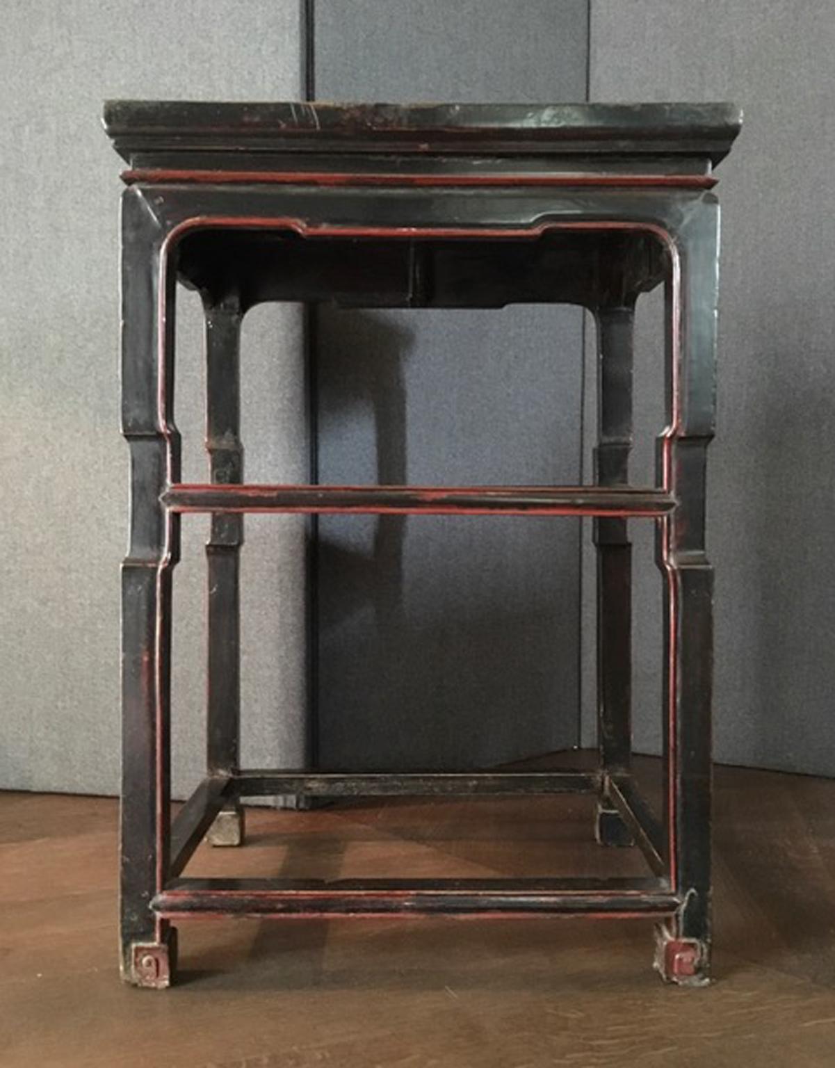This side table has the signs of the time and for this reason it's a piece that has a great charm. The antique black lacquer is not perfect cause its three Centuries of life, but it remains a very beautiful piece. Red details on the legs.

Never