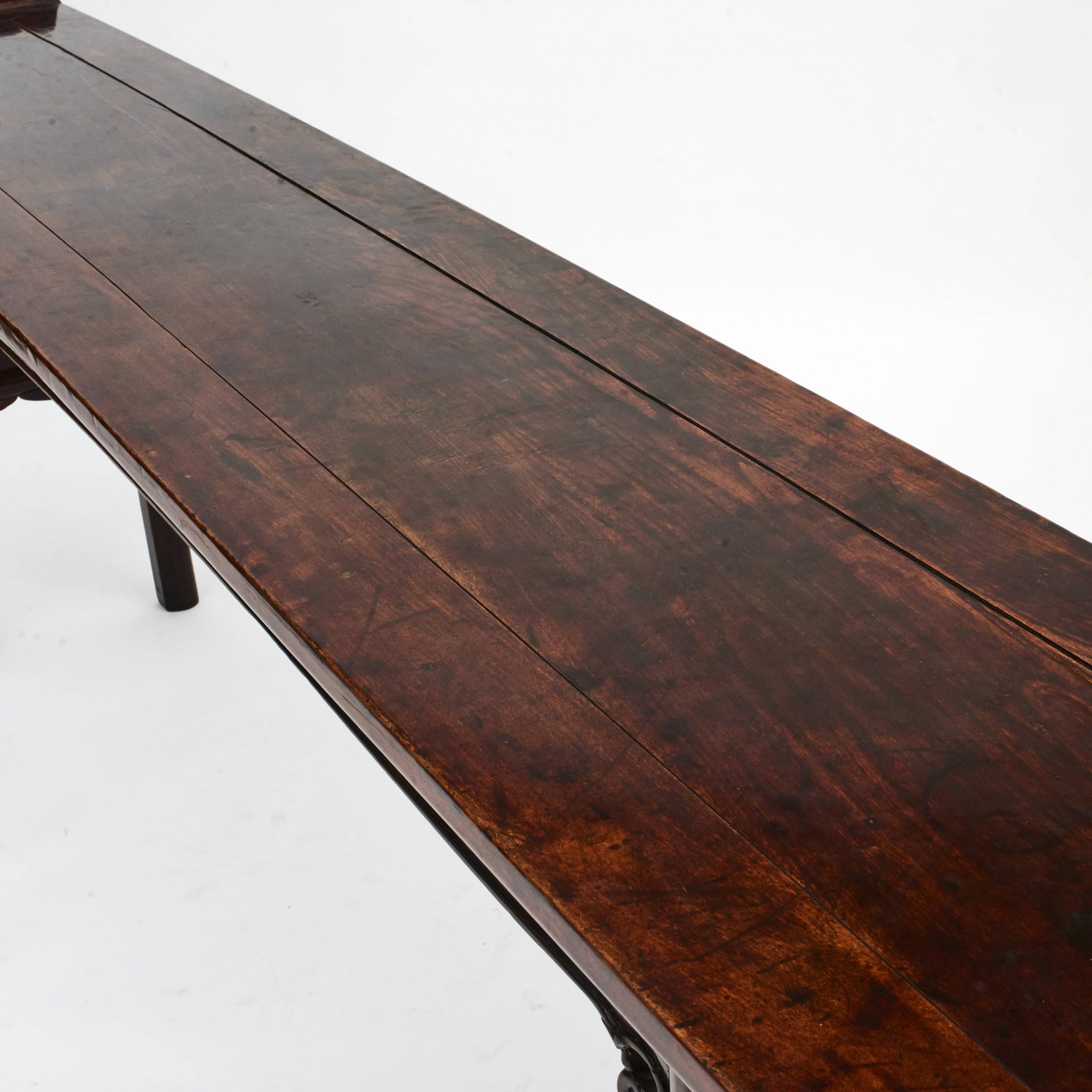 An elegant Chinese Ming style altar table made in walnut. Freestanding with same carved details on both sides and everted ends on the top.
Beautiful natural age-related patina highlighted with a light clear surface finish.

From Jiangsu, China,