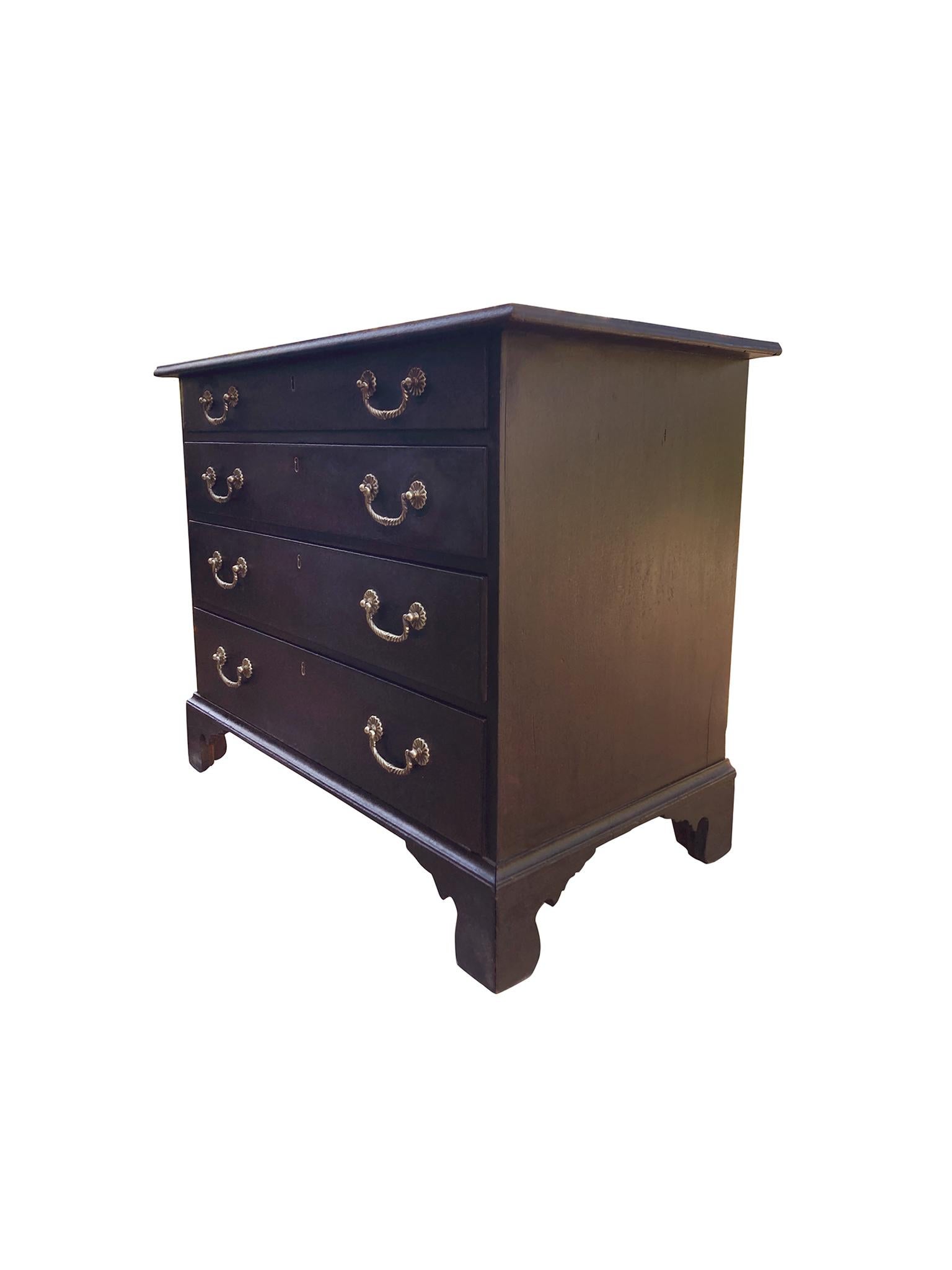 Hand-crafted by the school of cabinetmaker Joseph Short, whose family of carpenters lived in the late 18th and early 19th centuries in Newburyport, Massachusetts. This chest of drawer is mahogany with a dark finish that's accrued a textured patina