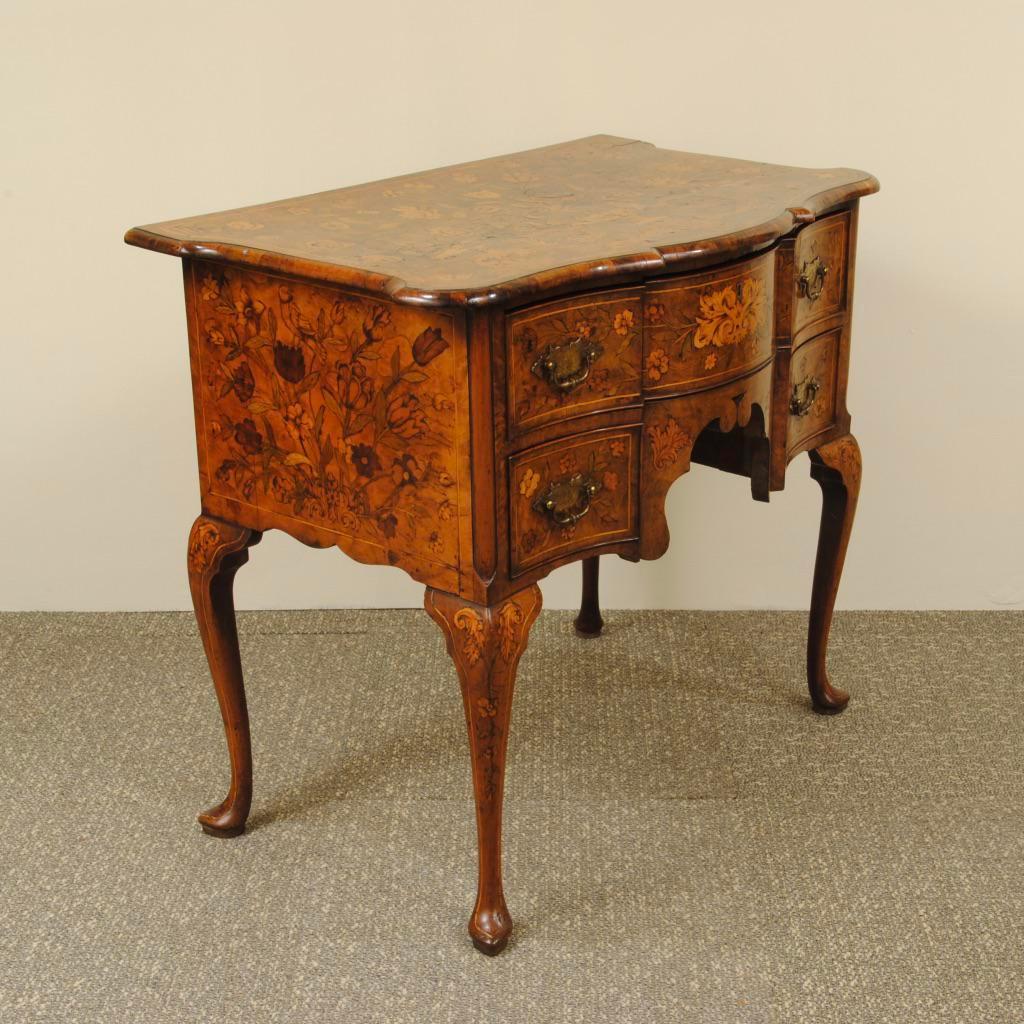 A late 18th century dutch walnut lowboy with profuse attractive floral marquetry throughout. Standing on cabriole legs with original handles, circa 1795.