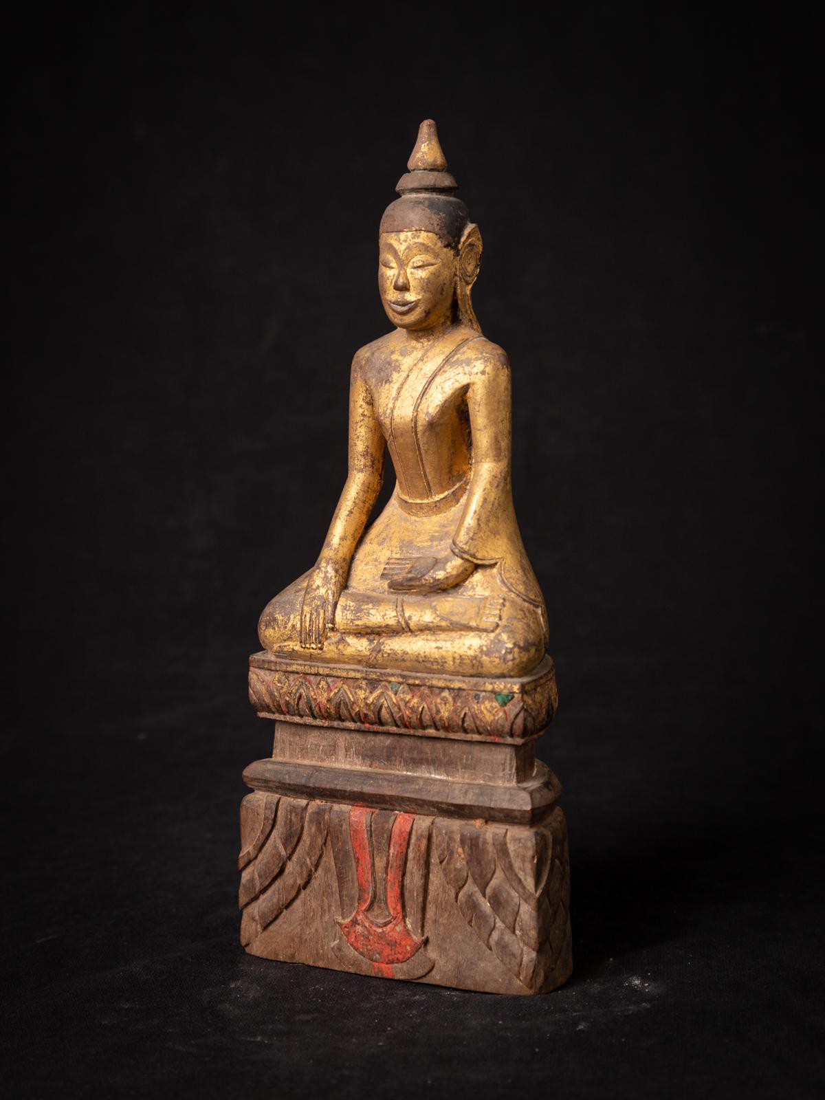 Discover the allure of an antique wooden Thai Buddha statue, a treasure steeped in history and spirituality. Carved from wood, this exquisite piece stands at 23.5 cm tall, with dimensions of 9.8 cm in width and 5.5 cm in depth. Its intricate details