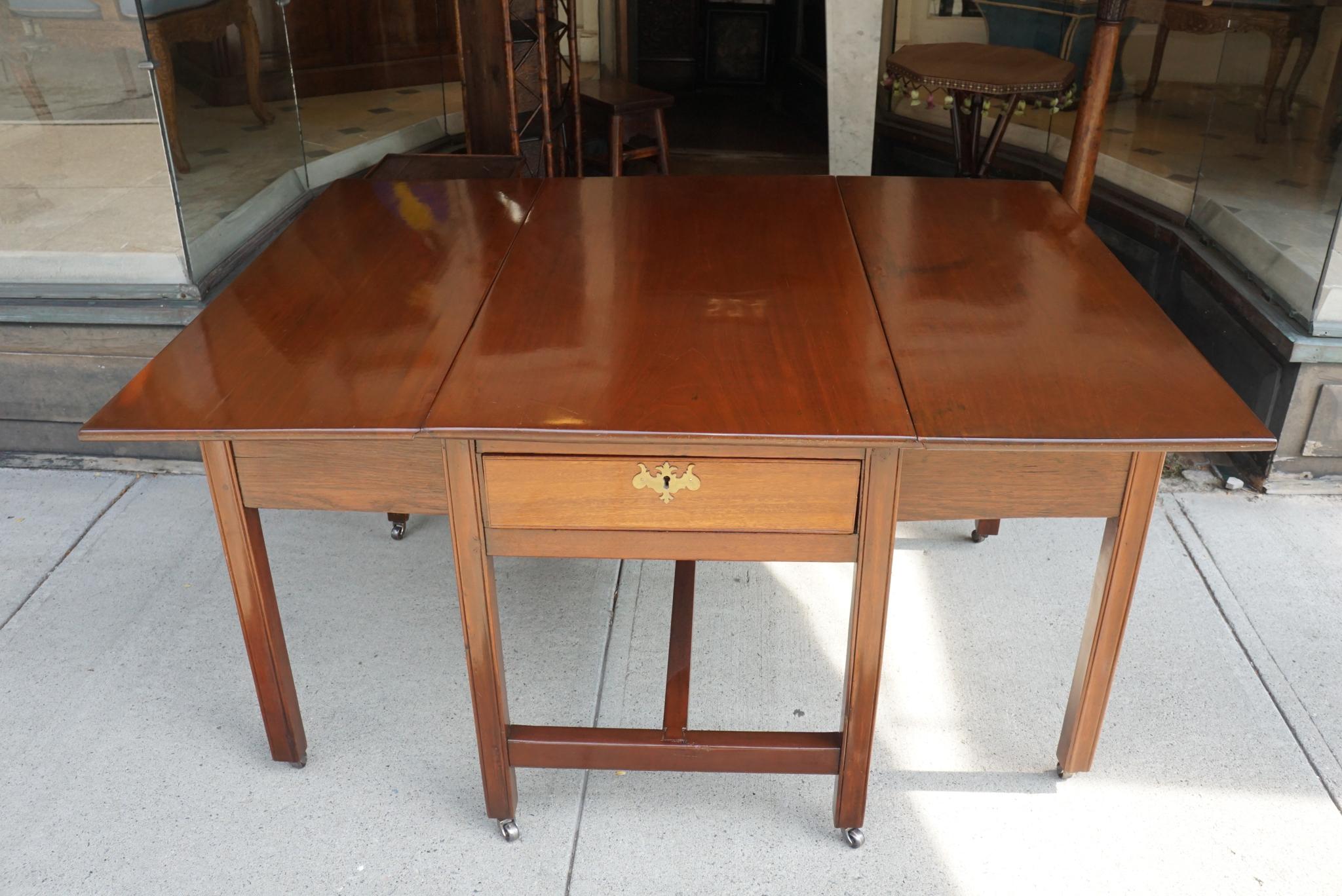 This table, circa 1780, is made of mahogany and has a new finish and replacement casters. This form of table has been in use since the 1600 but has in each successive generation been adapted to the current style and design fashionable at the time.