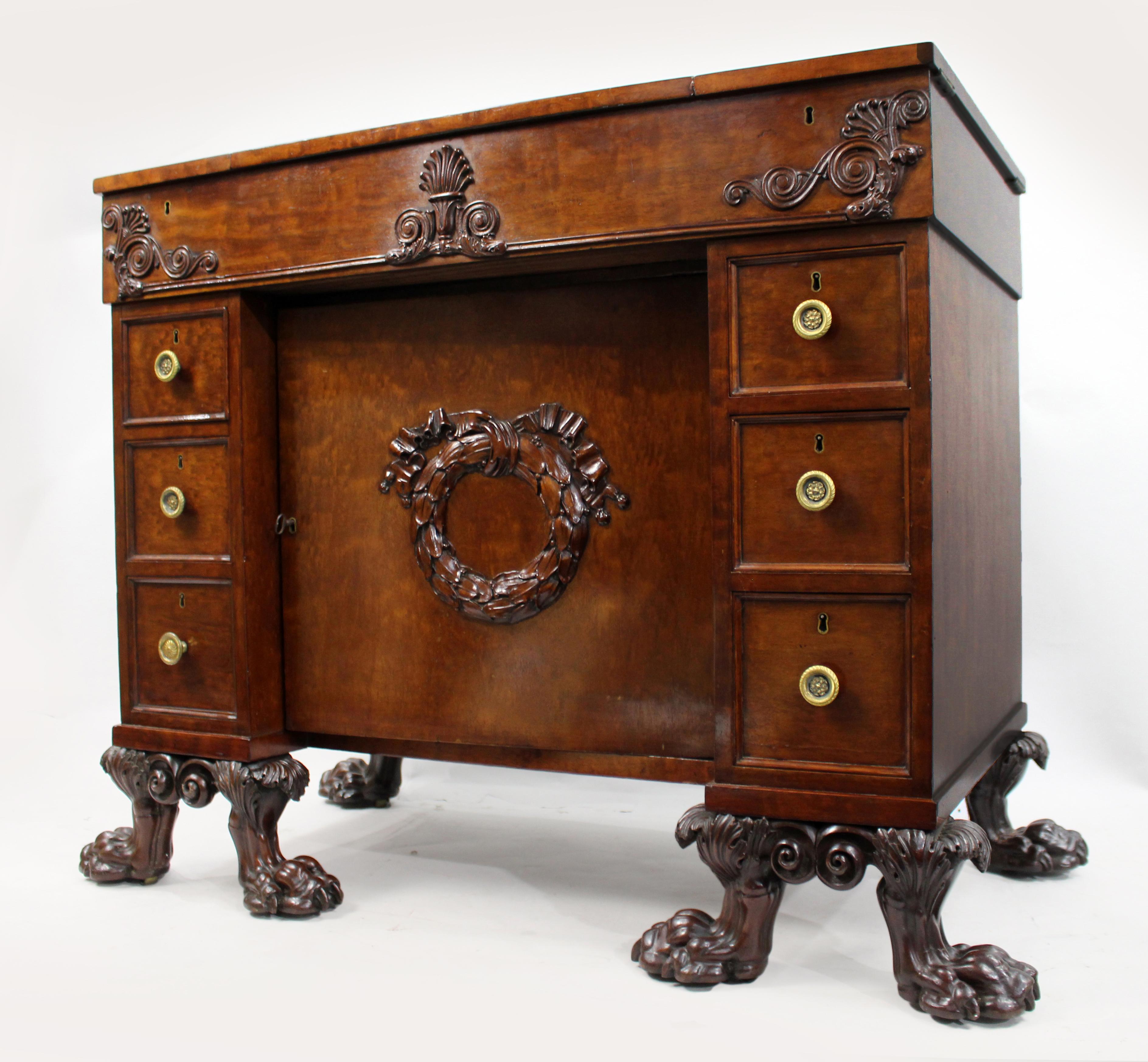 Exceptional Late 18th Century English Mahogany Work Table with Carved Paw Feet
United Kingdom, circa 1790

A superb George III period work or writing table, crafted in richly figured plum pudding mahogany and standing on boldly carved hairy paw feet