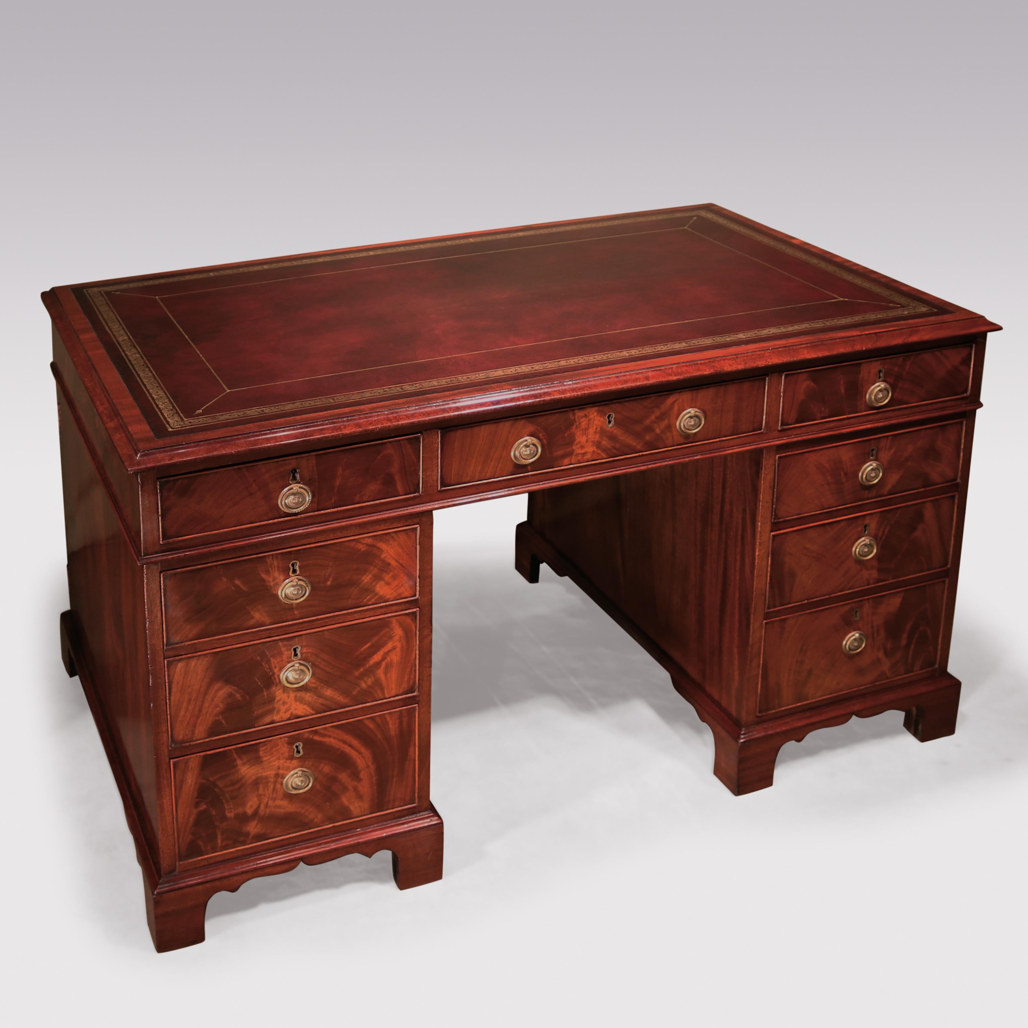 A fine quality late 18th century flame-figured mahogany pedestal desk of small proportions, having moulded edged gilt-tooled burgundy leather top with various cedar lined cockbeaded drawers to the front & panelled cupboard doors to the rear,