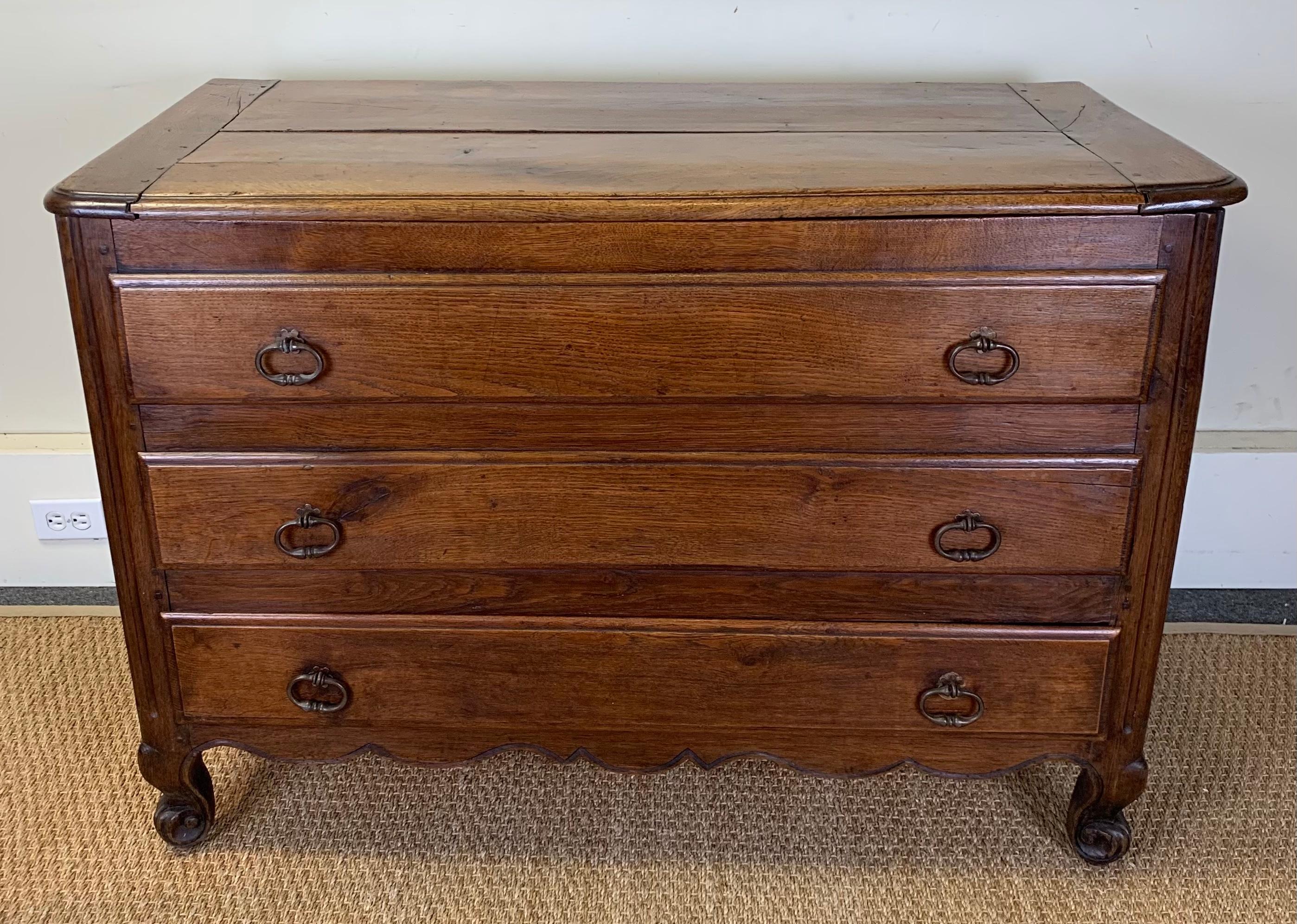 Late 18th C. oak French provincial blanket chest with two false drawers and one lower working drawer. The top opens to reveal deep storage for blankets and linens.
