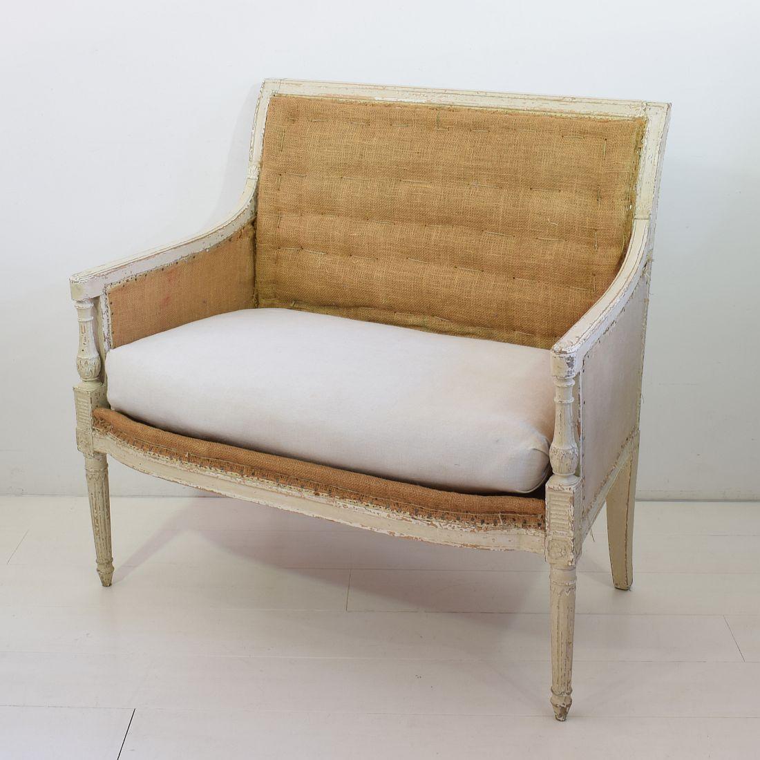 Beautiful French Directoire marquise with besides the directoire also some Louis XVI style influences visible. Very rare period piece.
France, late 18th century.
Weathered, small losses 
This piece of furniture is despite of its high age in a
