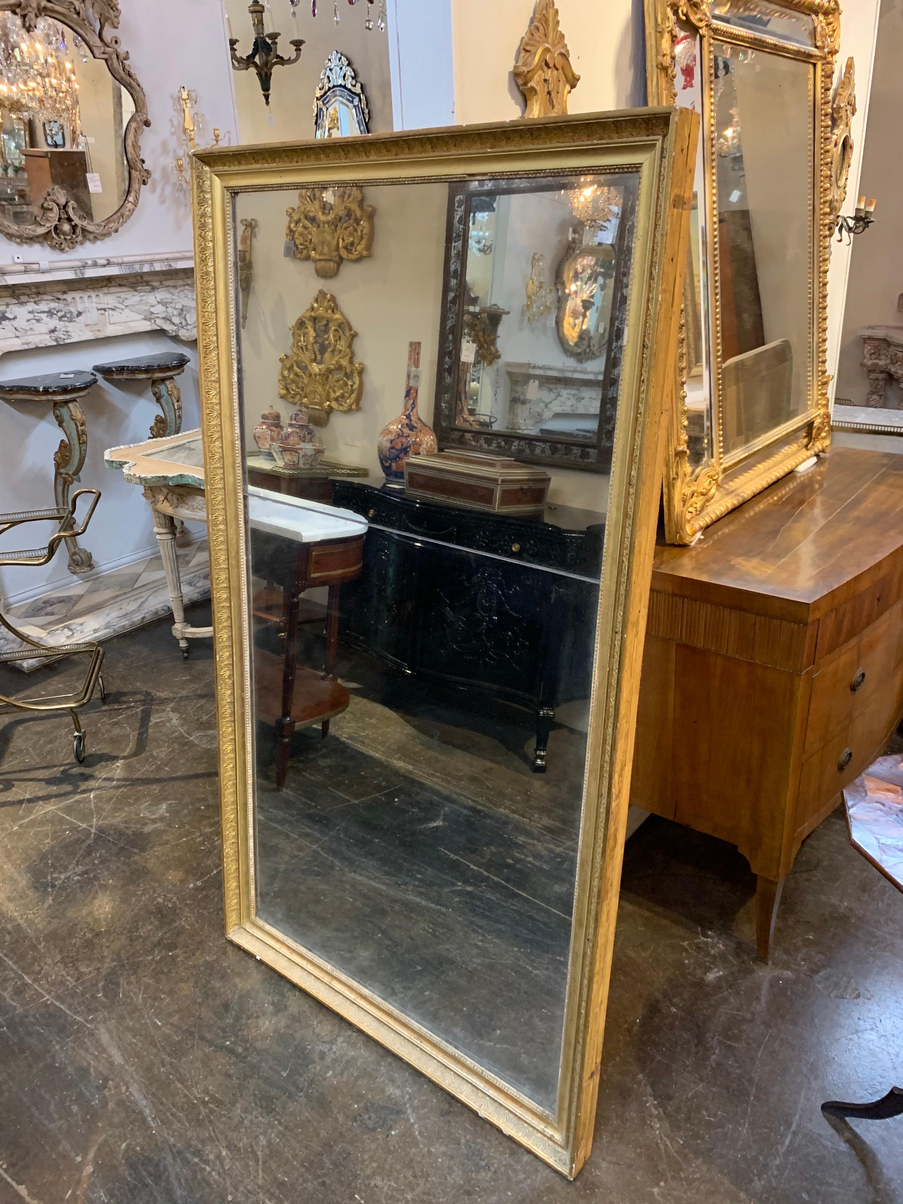 Splendid late 18th century French Directoire giltwood mirror. Decorative carved pattern and original divided glass. Fantastic!