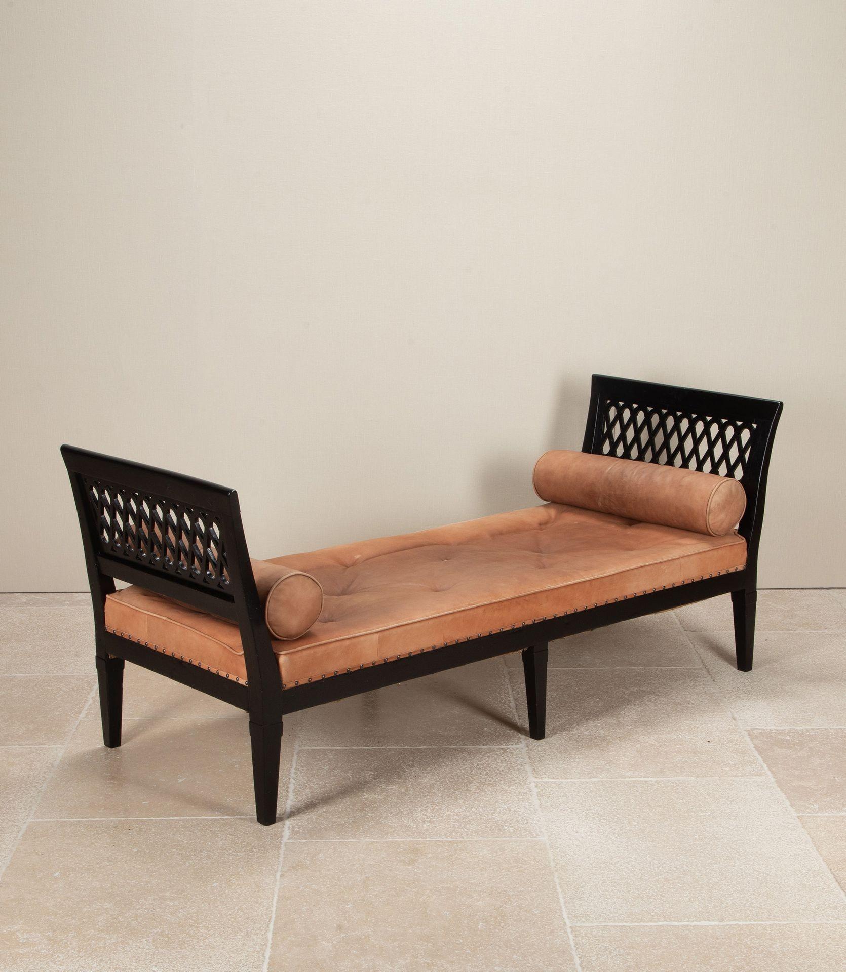 A fabulous late 18th Century French ebonised daybed.
With a leather seat and bolsters, probably recovered in the mid-20th Century. 
Some marks commensurate with age to the leather.