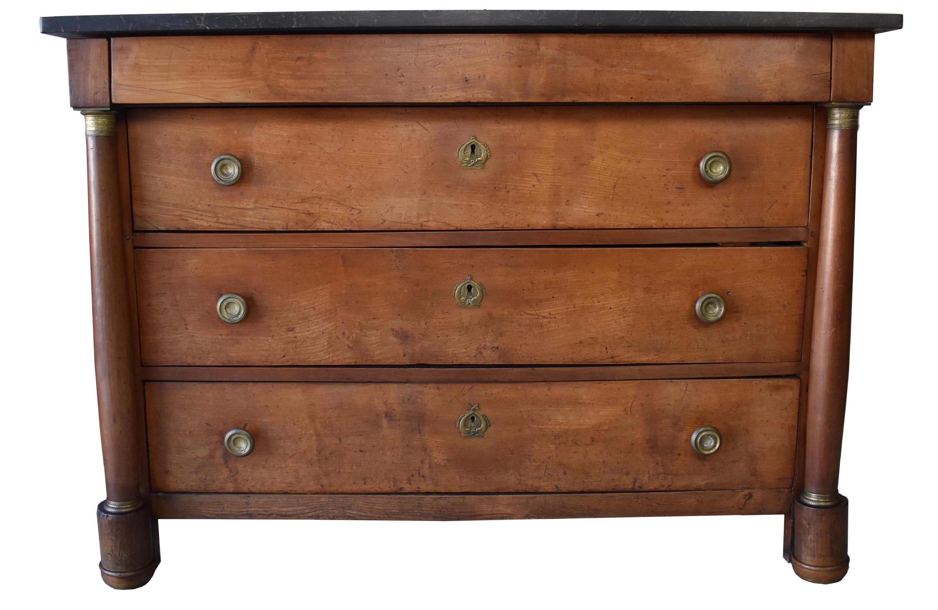 Stunning French Empire Chest from the late 18th century made of solid cherry, with original hardware and black marble. This piece was hand selected by us because of its large size and beautiful condition. The chest features pegged construction and