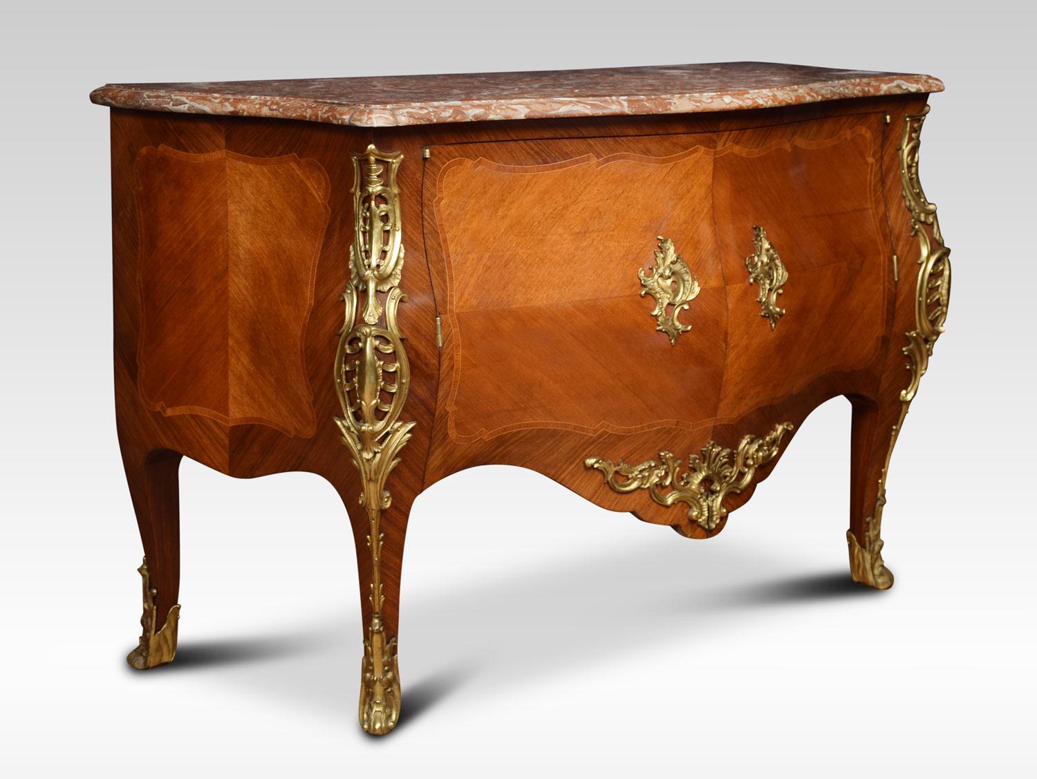 Late 18th century French gilt bronze-mounted walnut bombe shaped commode with a molded Spanish brocatello marble top above a pair of quarter-veneered doors, opening to reveal two short and one long drawers all raised up on cabriole legs terminating