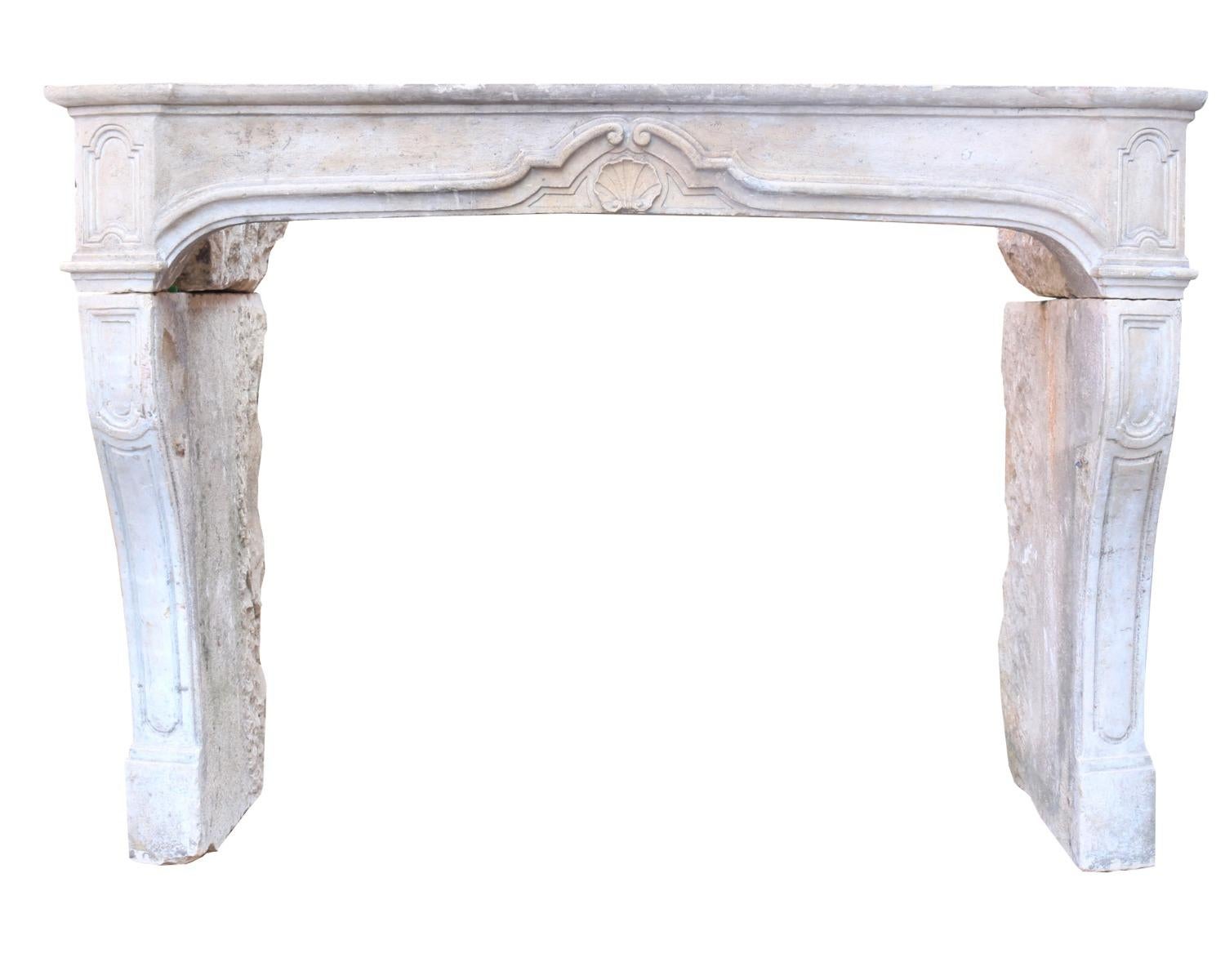 An attractive pale limestone surround with shaped top, frieze with central shell motif and curving supports.

Measure: Depth 90 cm (maximum) 60 cm (visible once installed)

The depth could be reduced further if required.

Opening Height 94.5
