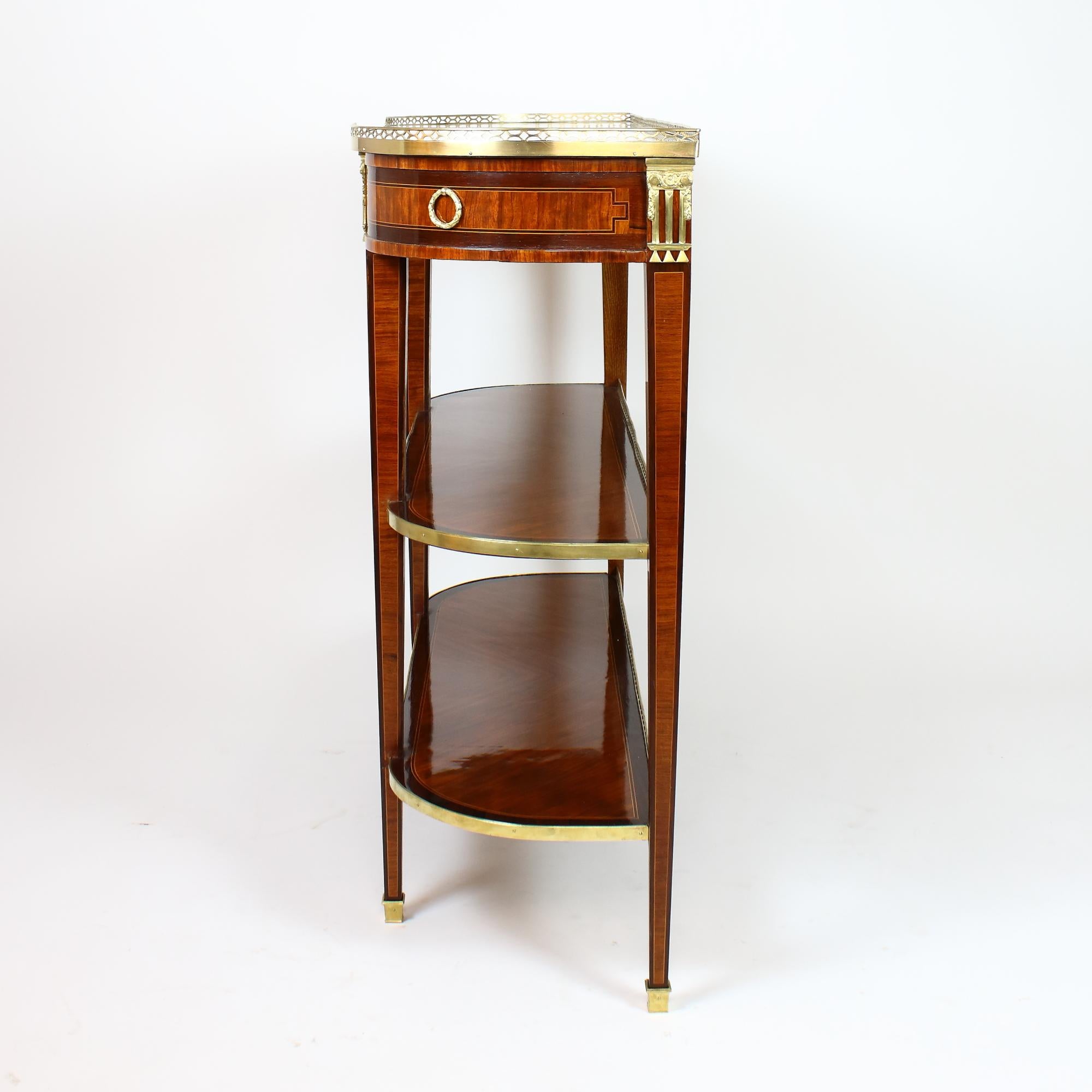 Late 18th century French Louis XVI marquetry console table or desserte.

Rectangular console table with extended width and rounded corners standing on four rectangular tapering legs, front with a frieze drawer accompanied by two trompe