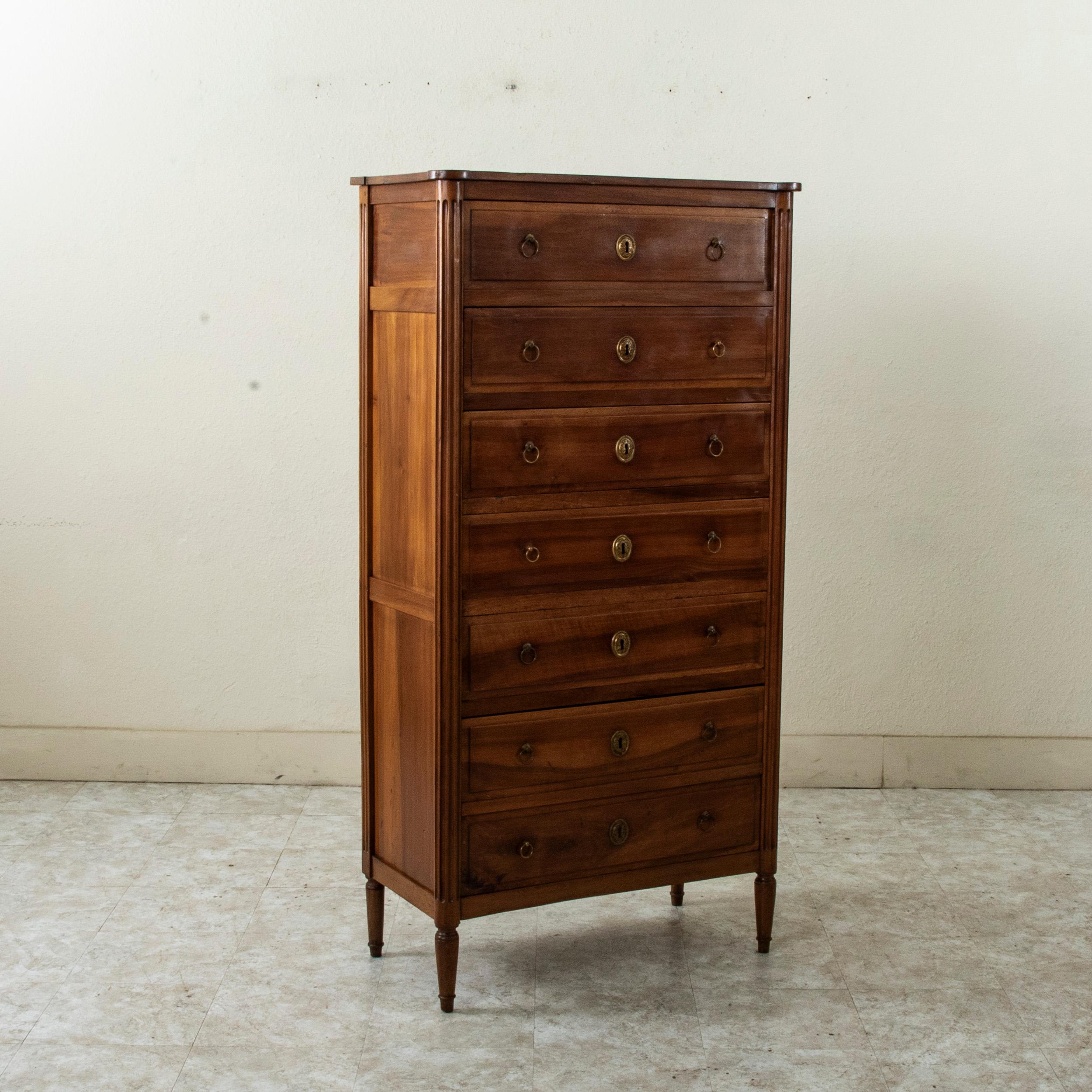 This late eighteenth century Louis XVI period chest of drawers is called a semainier in French due to its seven drawers. Semainier comes from the French word 
