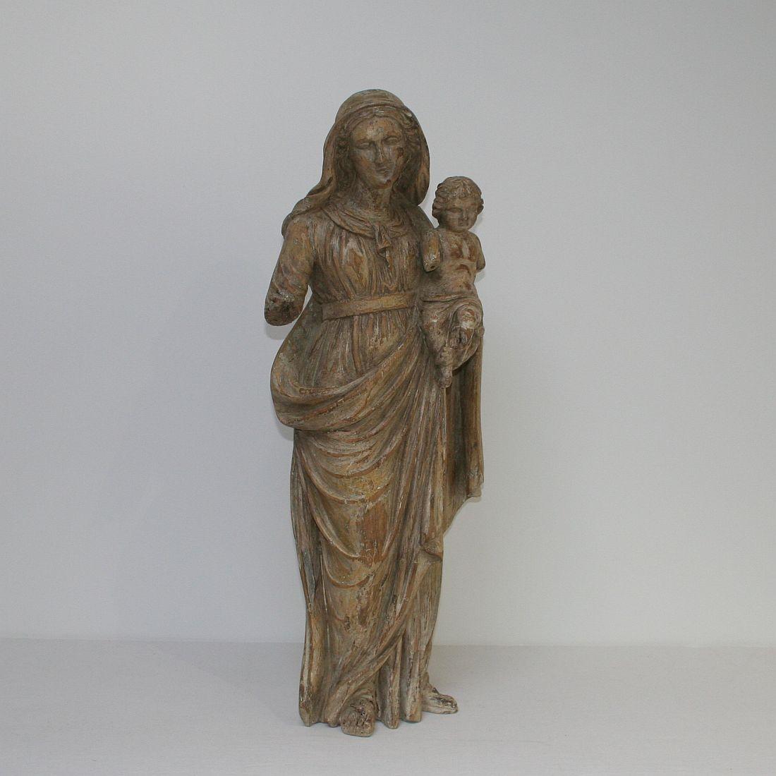 Beautiful Madonna with child with a great patina, France, 18th century. Weathered, small losses.