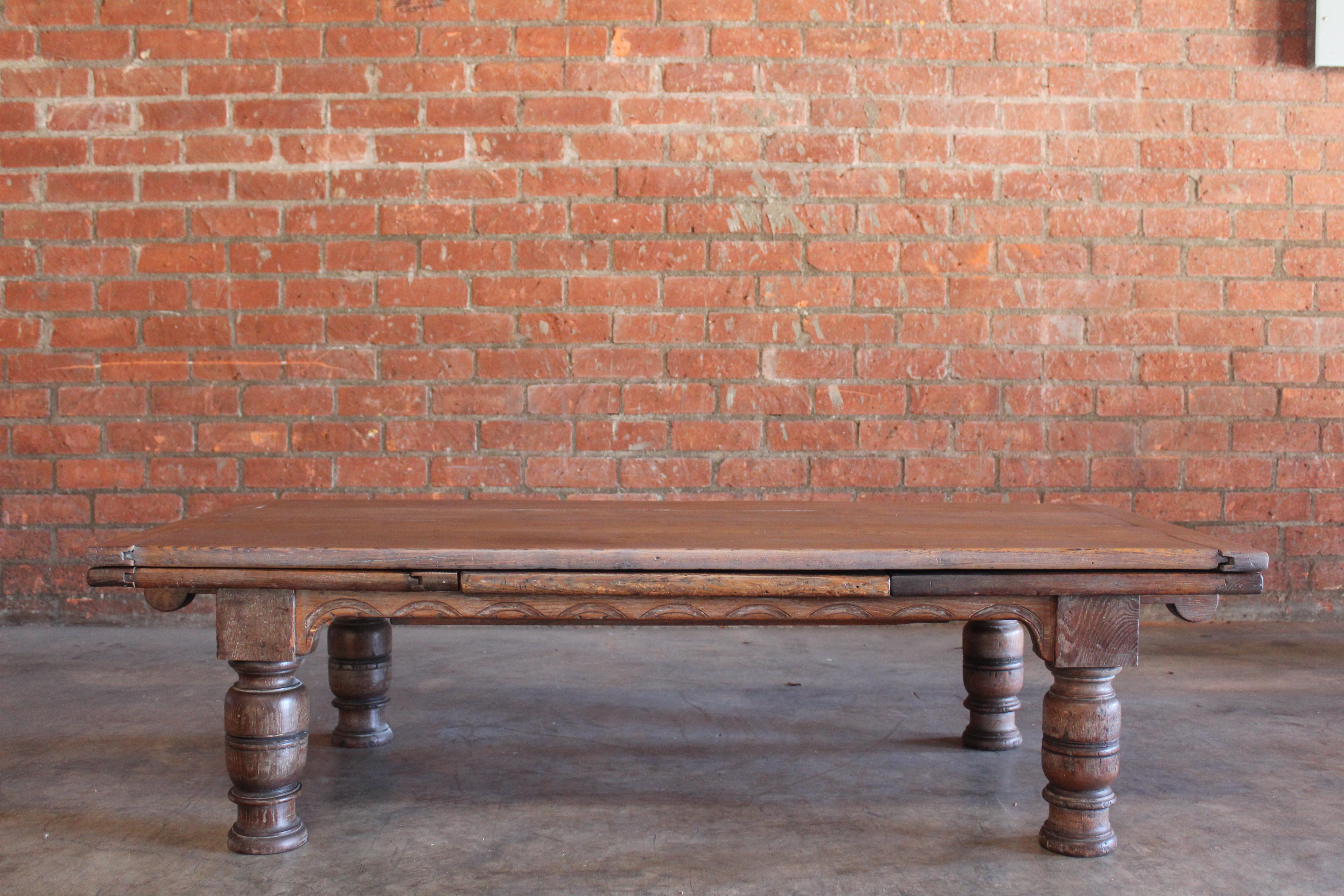 Antique solid oak expandable coffee table, France, late 18th century.
68 wide, 112.5 wide when expanded. In overall excellent condition.