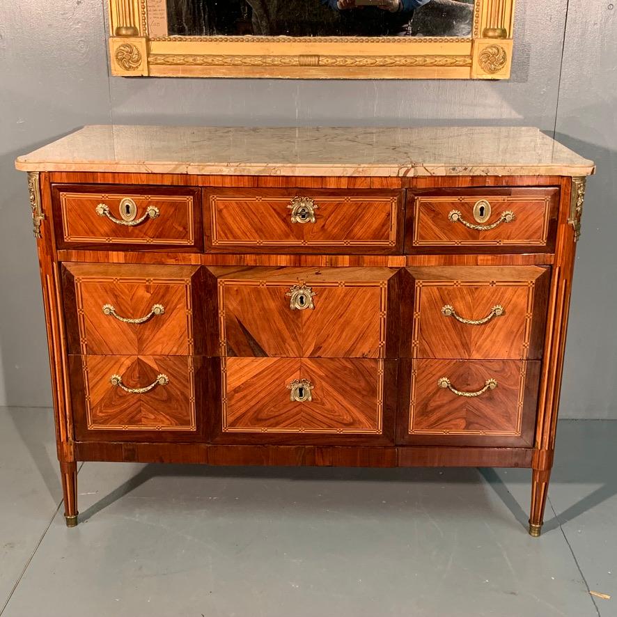 A very good quality late 18th century French tulipwood and inlaid marble top commode in fabulous condition and wonderful color tones.
The commode has three drawers above two full width drawers below, all oak lined and noticeably finer drawers than