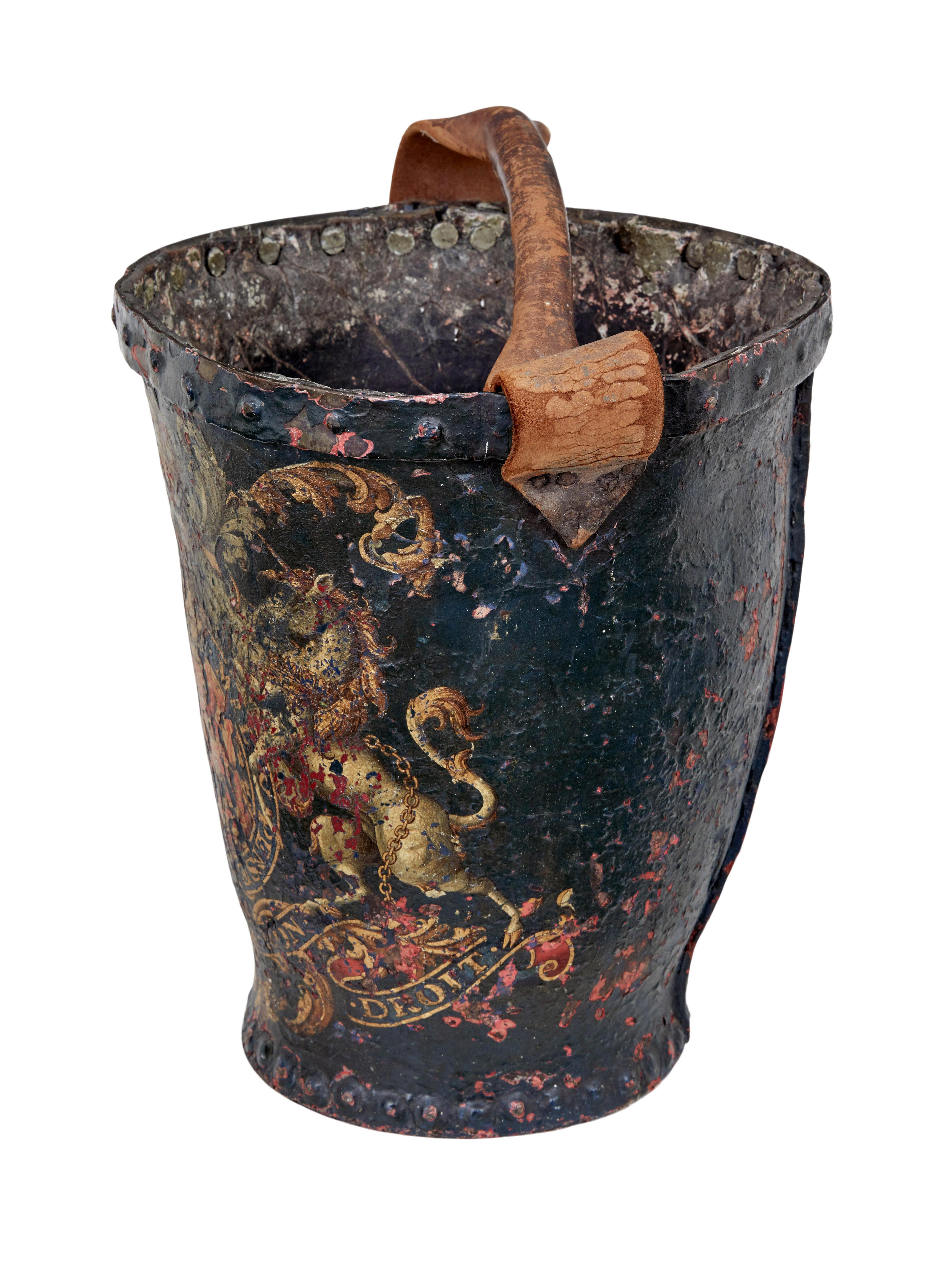 Late 18th century George III leather hand painted fire bucket circa 1780.

Good quality leather fire bucket.  Armorial decorated, inscribed honi soit-oui mal y pense, which means shamed be whoever things evil of it, which was used by the british