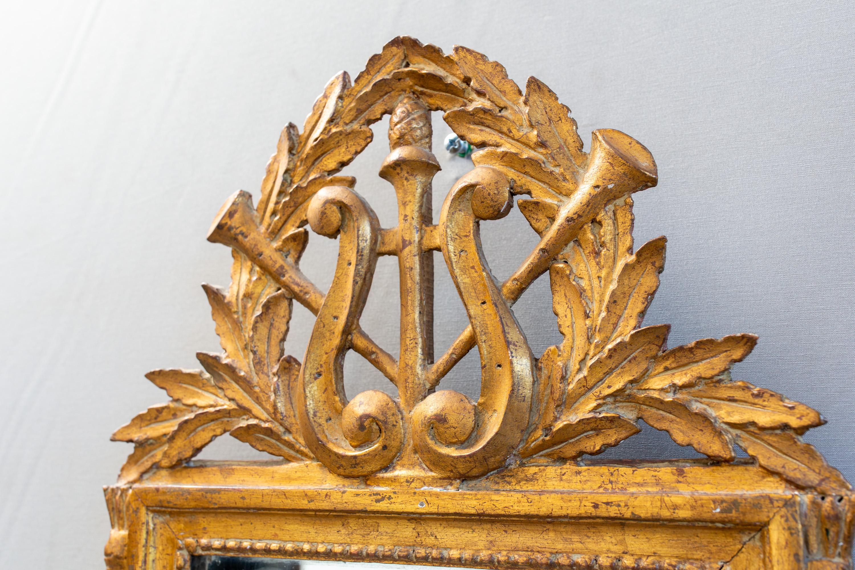 Gilded and carved late 18th century French mirror with lyre and acanthus detail. Very good condition considering age.