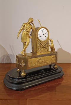 LATE 18th CENTURY GILT BRONZE CLOCK WITH ADONIS