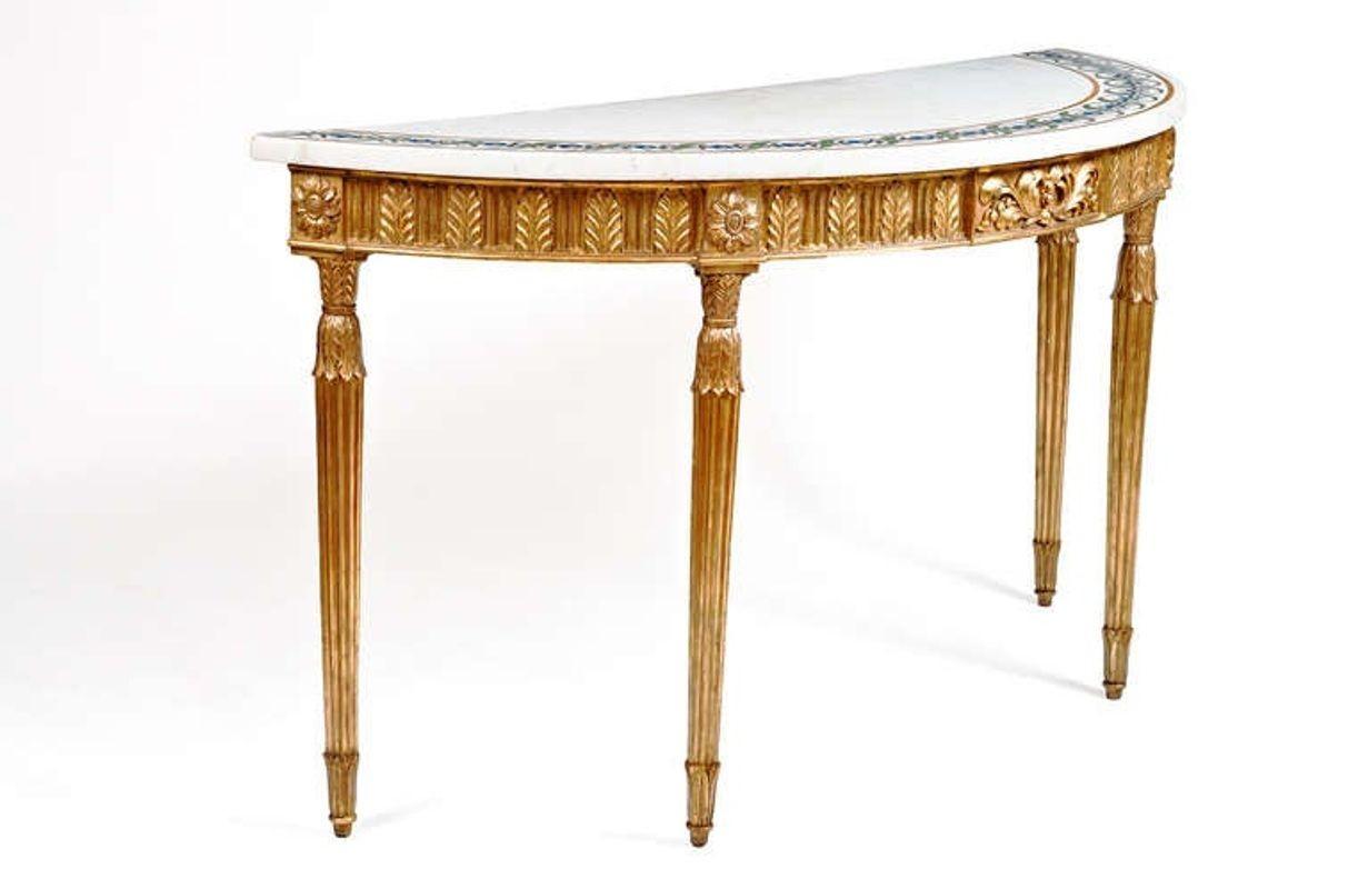 Late 18th century gilt console table with inlaid marble top.