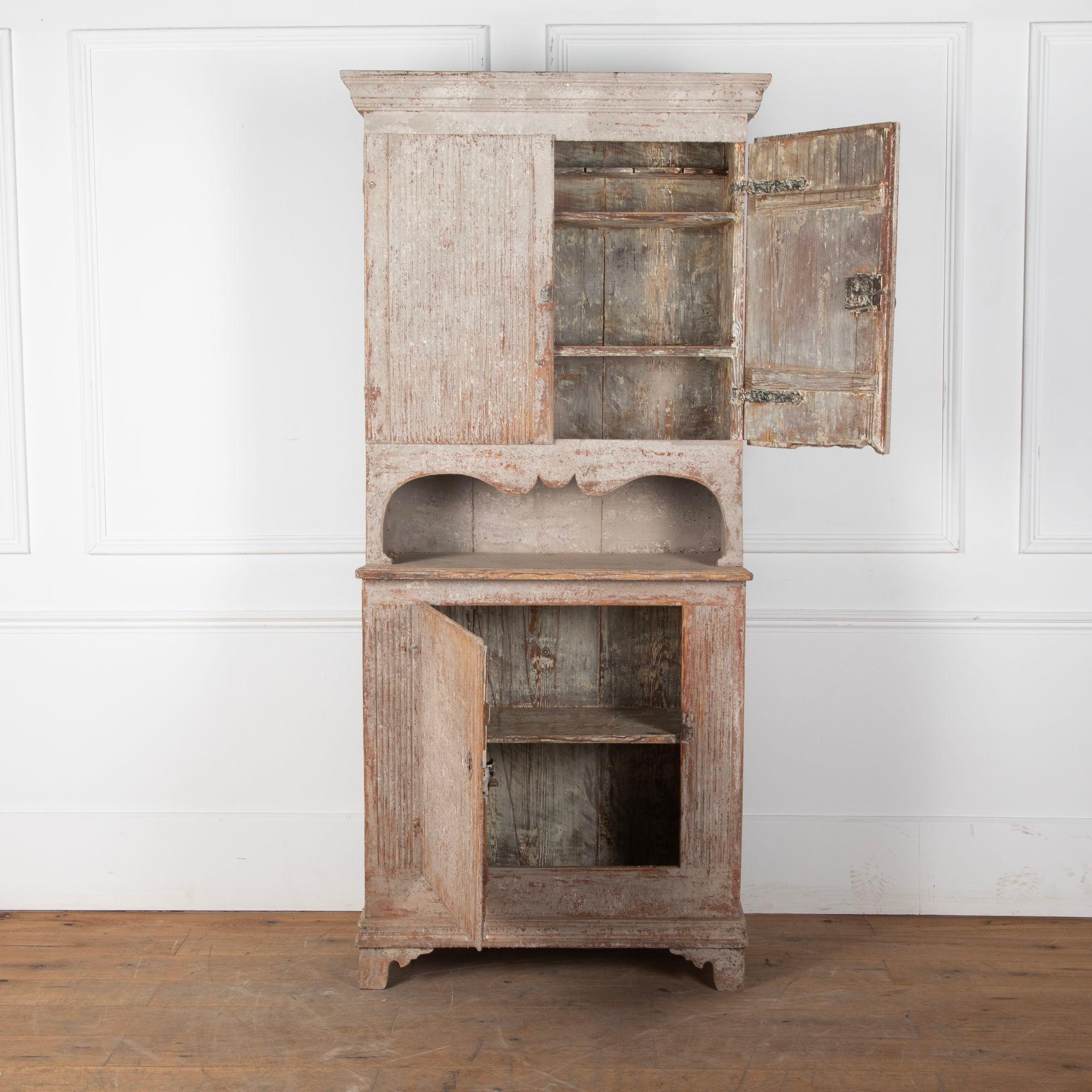 Late 18th Century Gustavian Cupboard with reeded doors.
Later painted and dry scraped to old paint on the inside, and the feet were replaced at a later date.
Circa 1790.