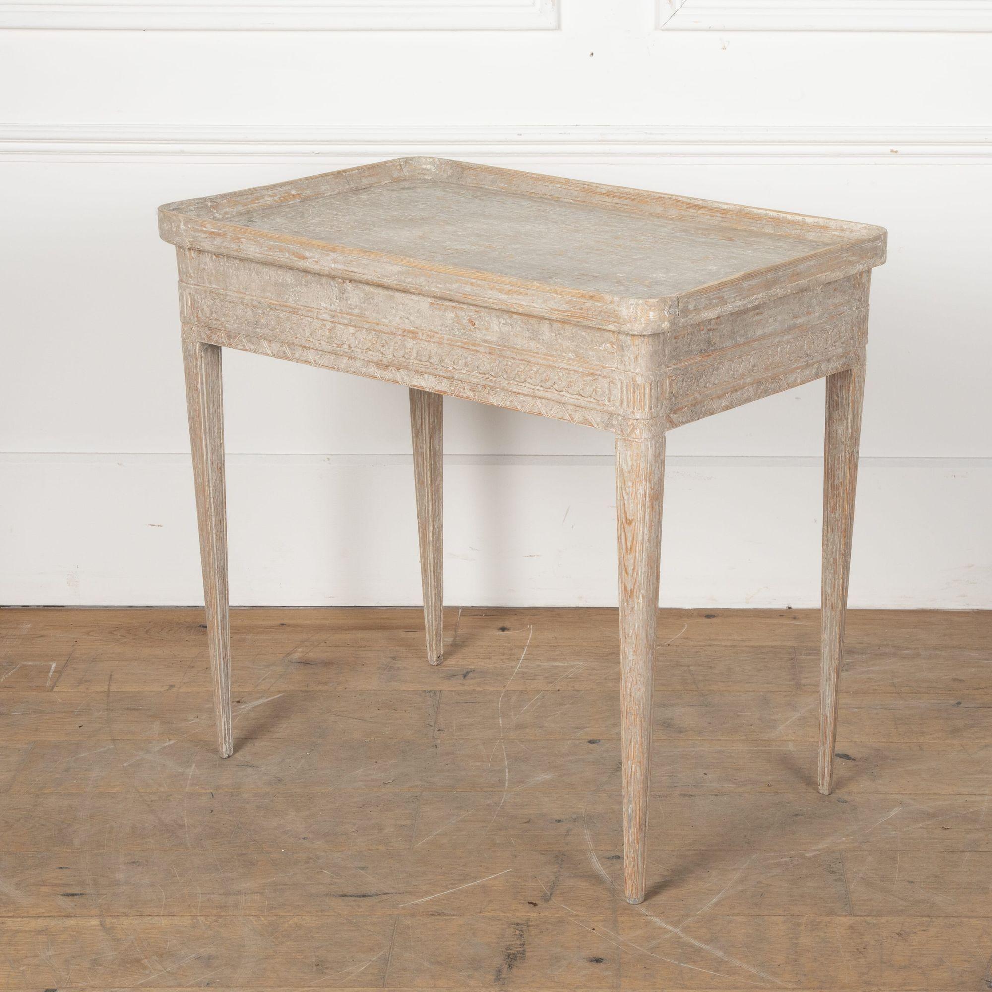 Beautifully carved freestanding Gustavian tray table.
Later painted with an old repair to one of the tray corners.
circa 1790.