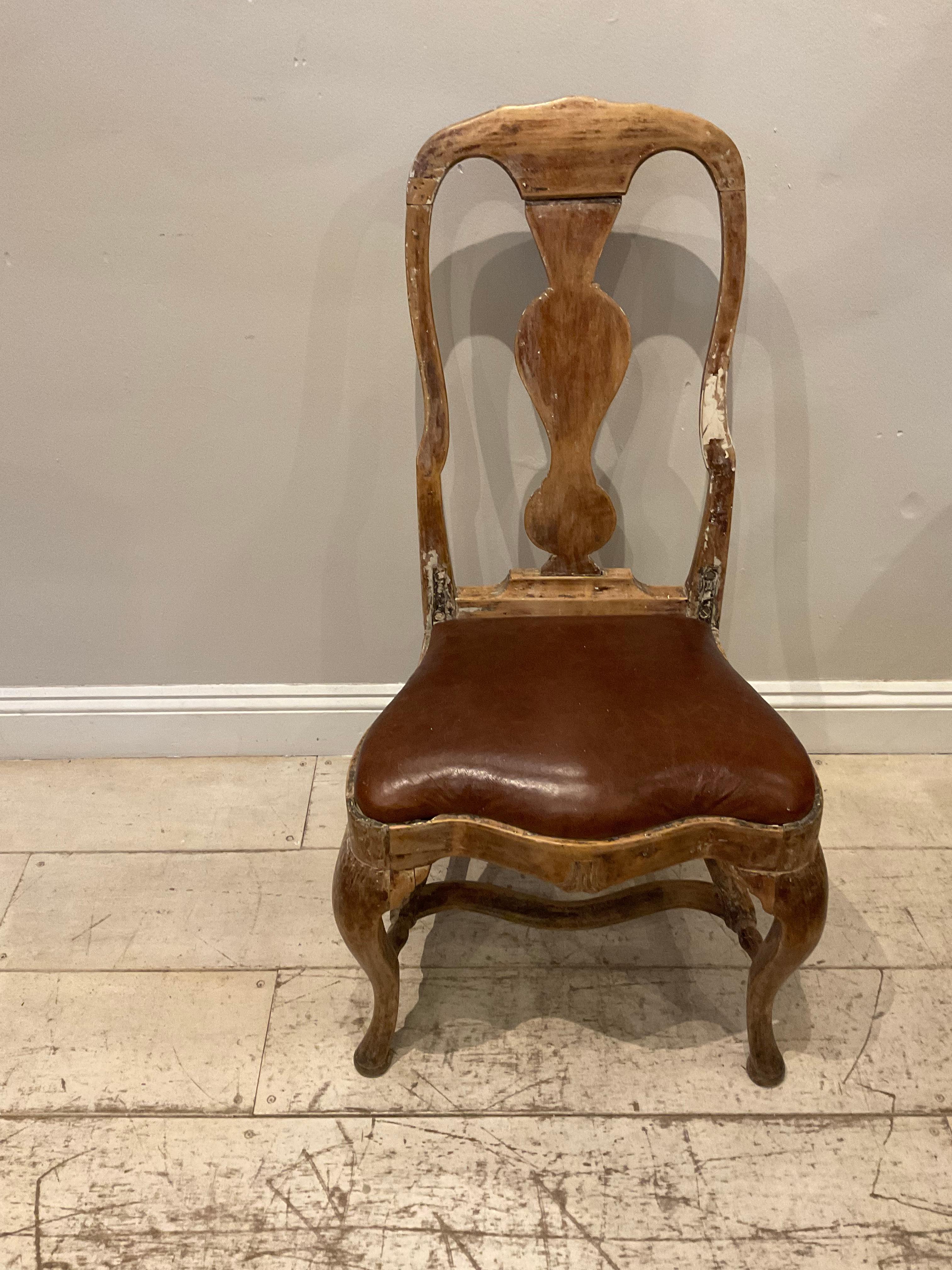 C18th Swedish rococo chair with leather seat.
A handsome single high backed chair circa 1760 which has a simple understated well-worn patina and a leather drop in seat that's been replaced over time.

Perfect for use as a desk chair or statement